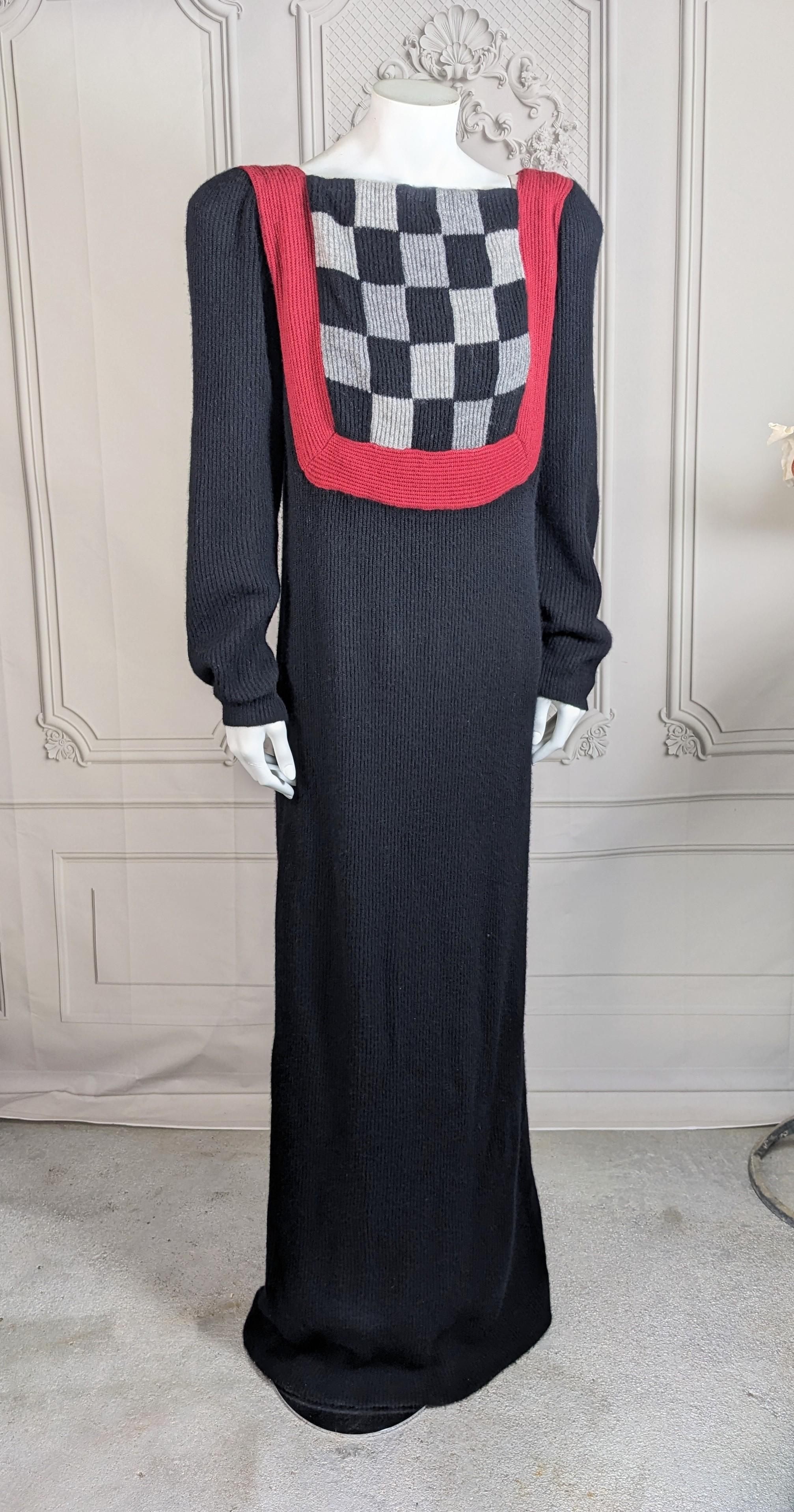 Bob Mackie Cashmere Knit Gown of ribbed knit from the 1990's. Long gown with strong shoulders. A checkerboard bib effect on front with ribbed rasberry knit trim which frames the bib and continues up the extended shoulders and around the back.
