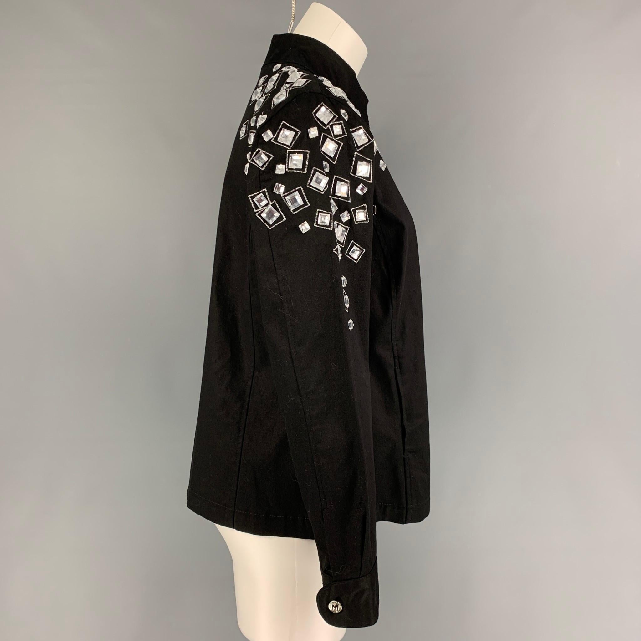 BOB MACKIE jacket comes in a black & silver cotton featuring crystal embellishments, stand up collar, and a zip up closure. 

Very Good Pre-Owned Condition.
Marked: 1X

Measurements:

Shoulder: 18 in.
Bust: 50 in.
Sleeve: 24 in.
Length: 25 in. 