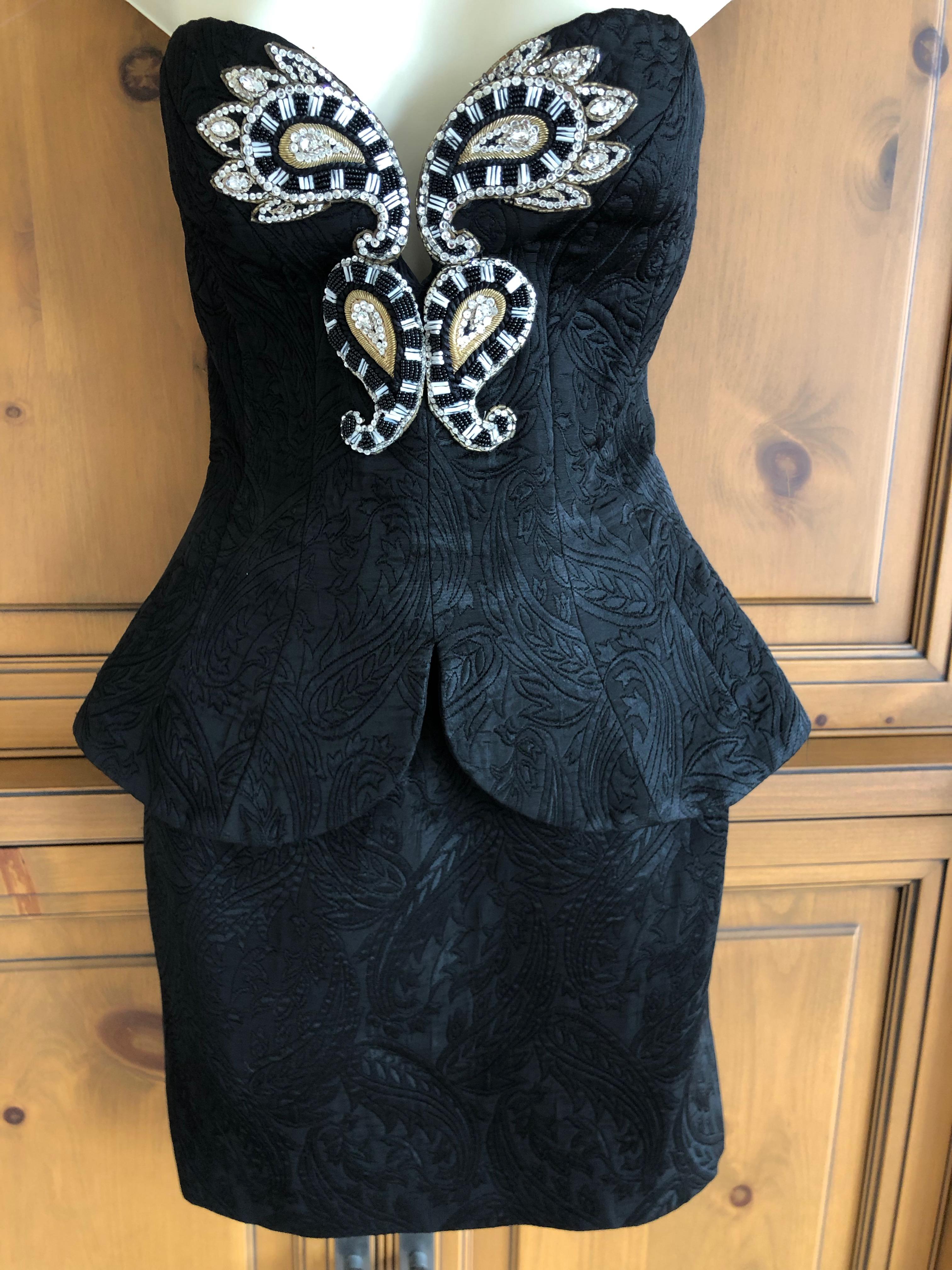 Bob Mackie Vintage 1980's Black Brocade Bustier Dress with Full Corset.
This is a full corset with skirt attached, a corset dress.
Marked size 10, but the hips are so small I could not get it on to my mannequin, so more like a size 4 in my