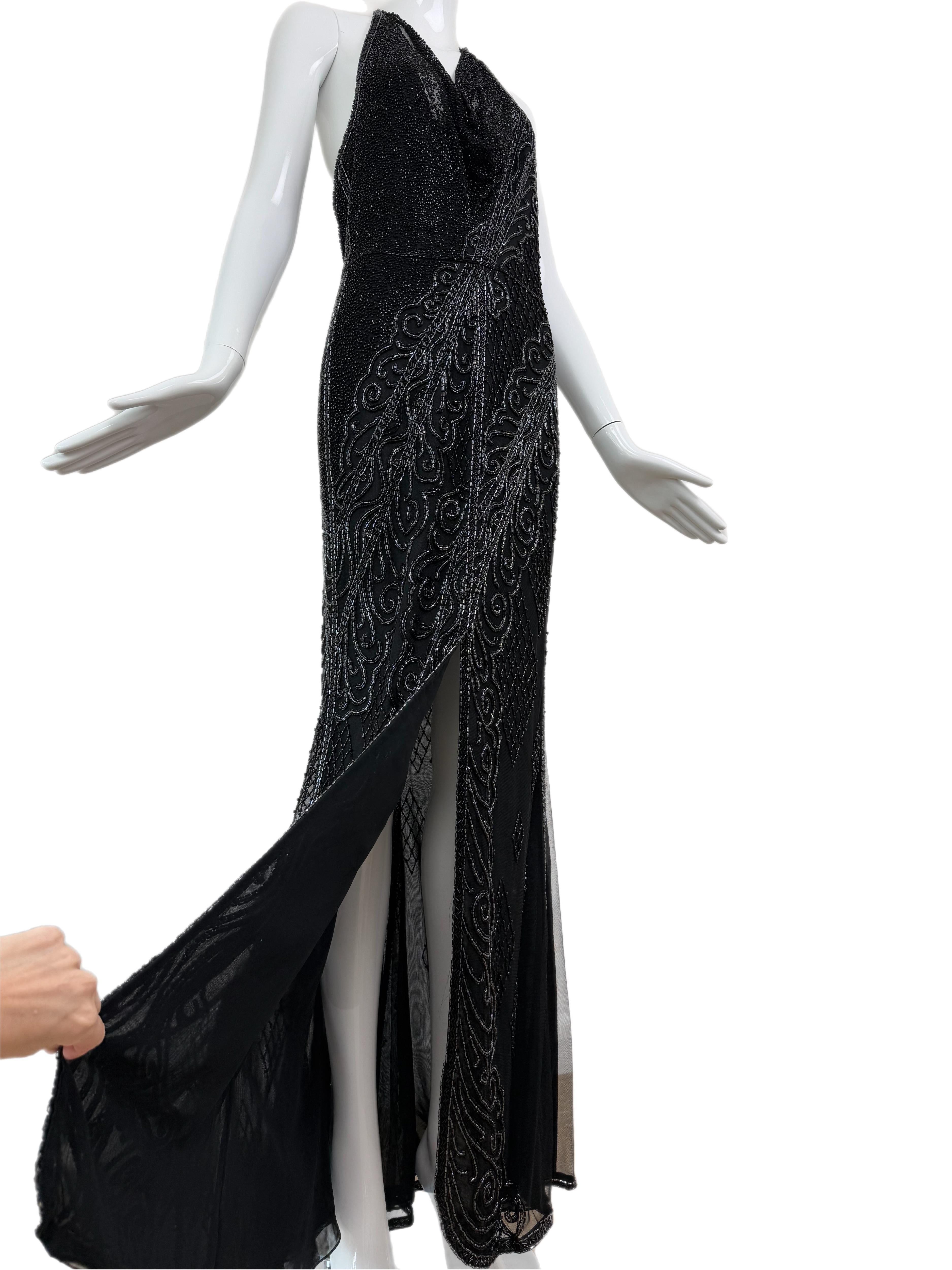 Bob Mackie
Vintage
Jet black and anthracite grey beads
Heavy beading and creative designs throughout
Halter top with sheer cowl neck
High front slit
Low open back
USA 6
NWT's, no flaws
This gown is a walking piece of art
It contains a medley of