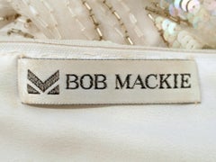 Bob Mackie White Long Sleeve Gown, with waves of Purple and Blue Beads & Sequins