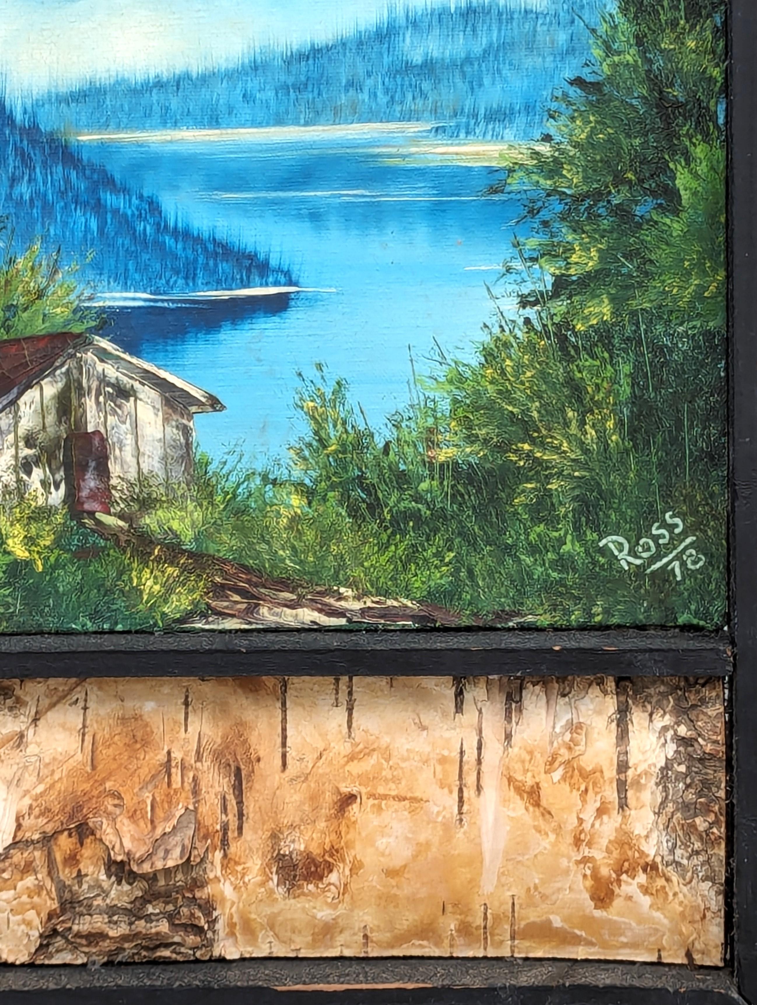Naturalistic blue and green toned Alaskan landscape painting by the beloved American painter Bob Ross. The work features a central mountain range with lush green trees and a small house in the foreground and a clear blue sky in the background.