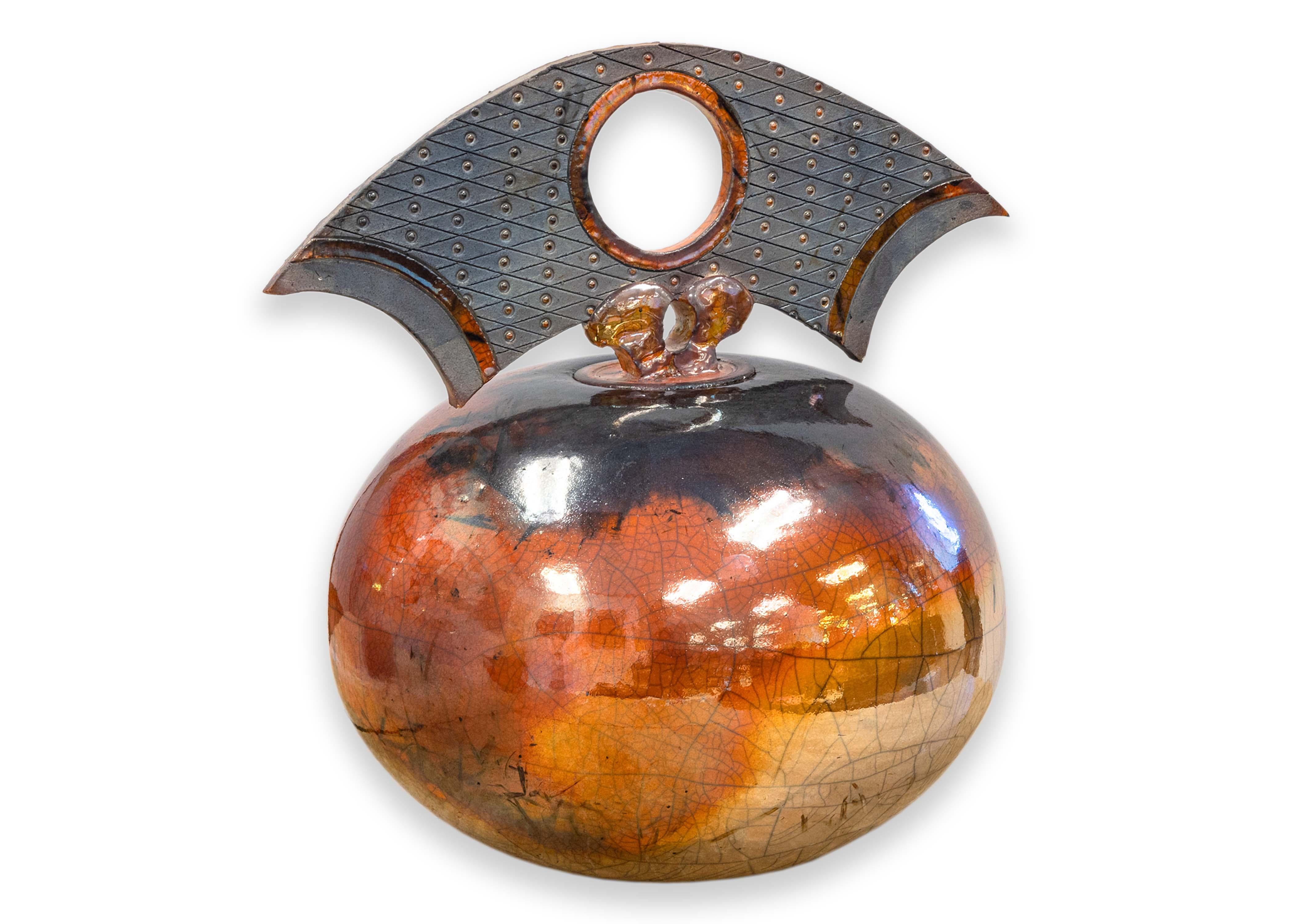 A postmodern raku fine art glazed pottery lidded vessel by Colorado artist Bob Smith. Signed on bottom. Created circa 2000s. A warm stunning orange color with crackly detail and a dramatic stylized topper. Along with his fine art studio pieces,