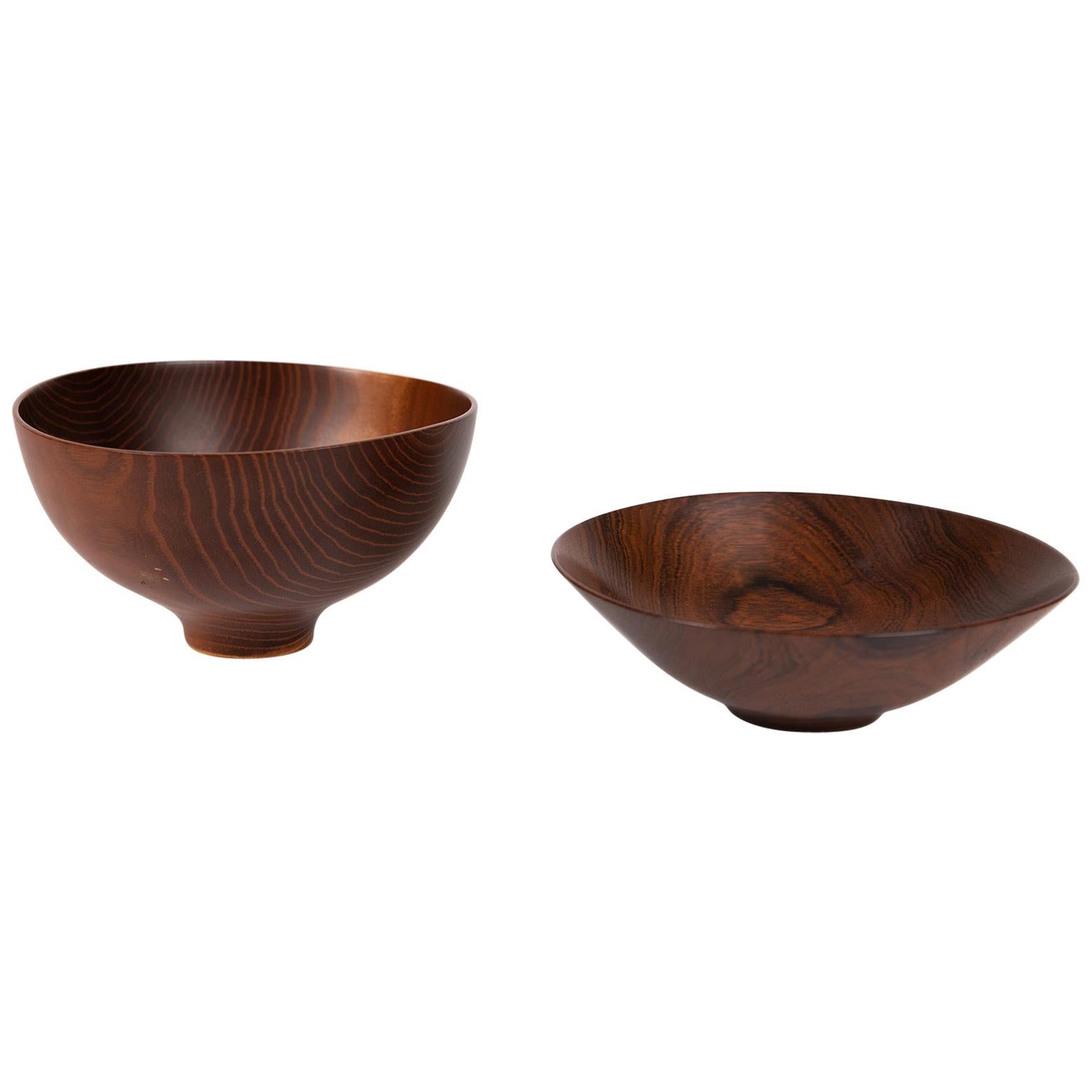 A masterfully turned wood bowl by Bob Stocksdale. The small bowl example is turned in Brazilian rosewood. It measures 2