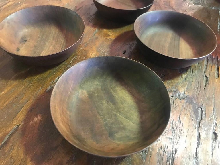 An elegantly designed, wonderfully executed, darkly colored set of four bowls by American master wood turner Bob Stocksdale. All are signed and marked (