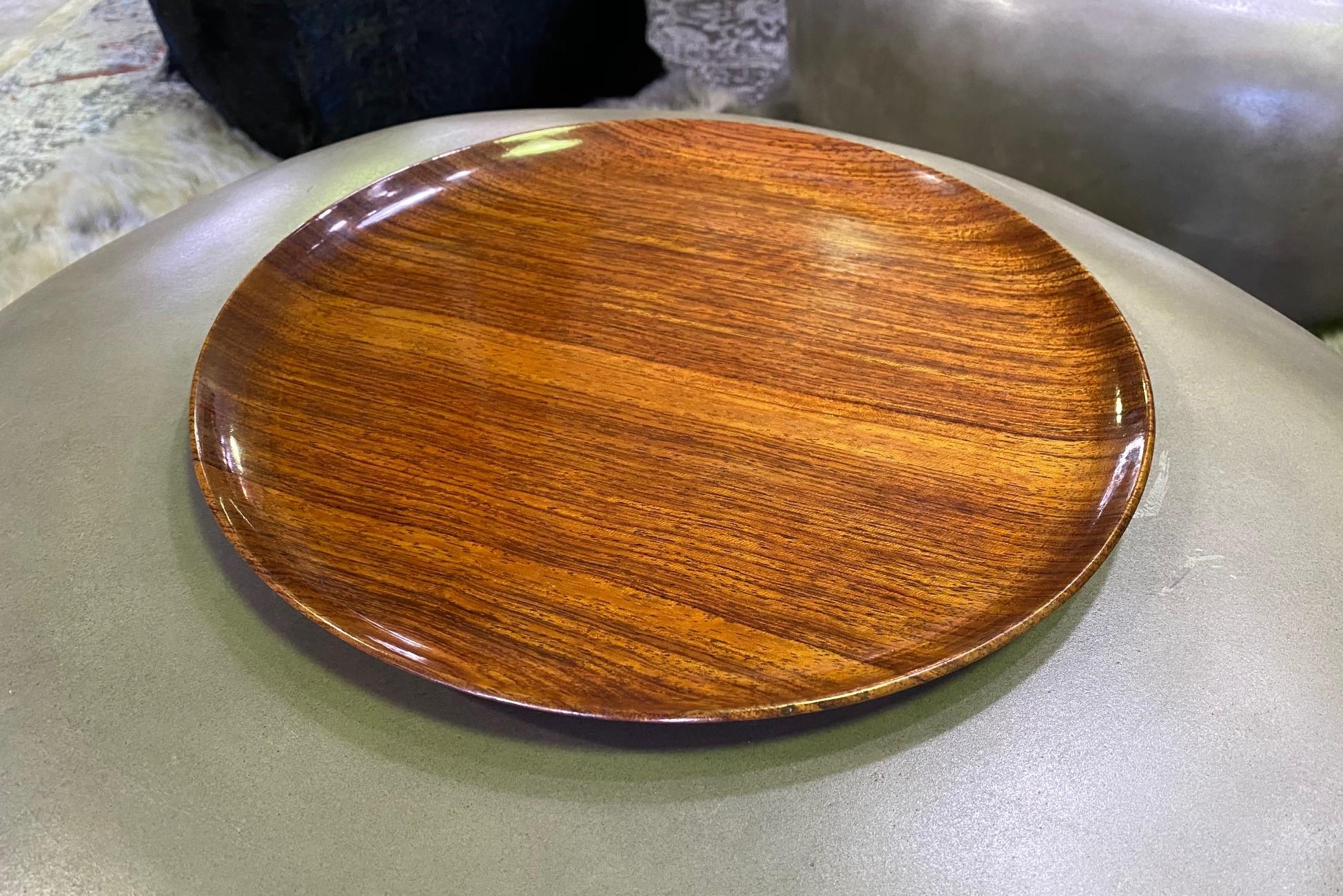 An exquisitely crafted, rich wood charger by American master Woodturner Bob Stocksdale. 

Signed and marked (