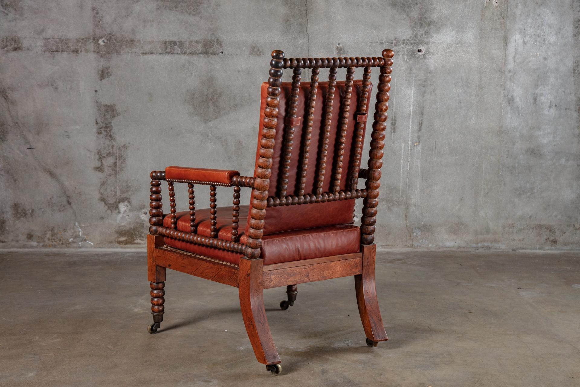 Sillón inglés de palisandro torneado con asiento de caña, S. XIX.