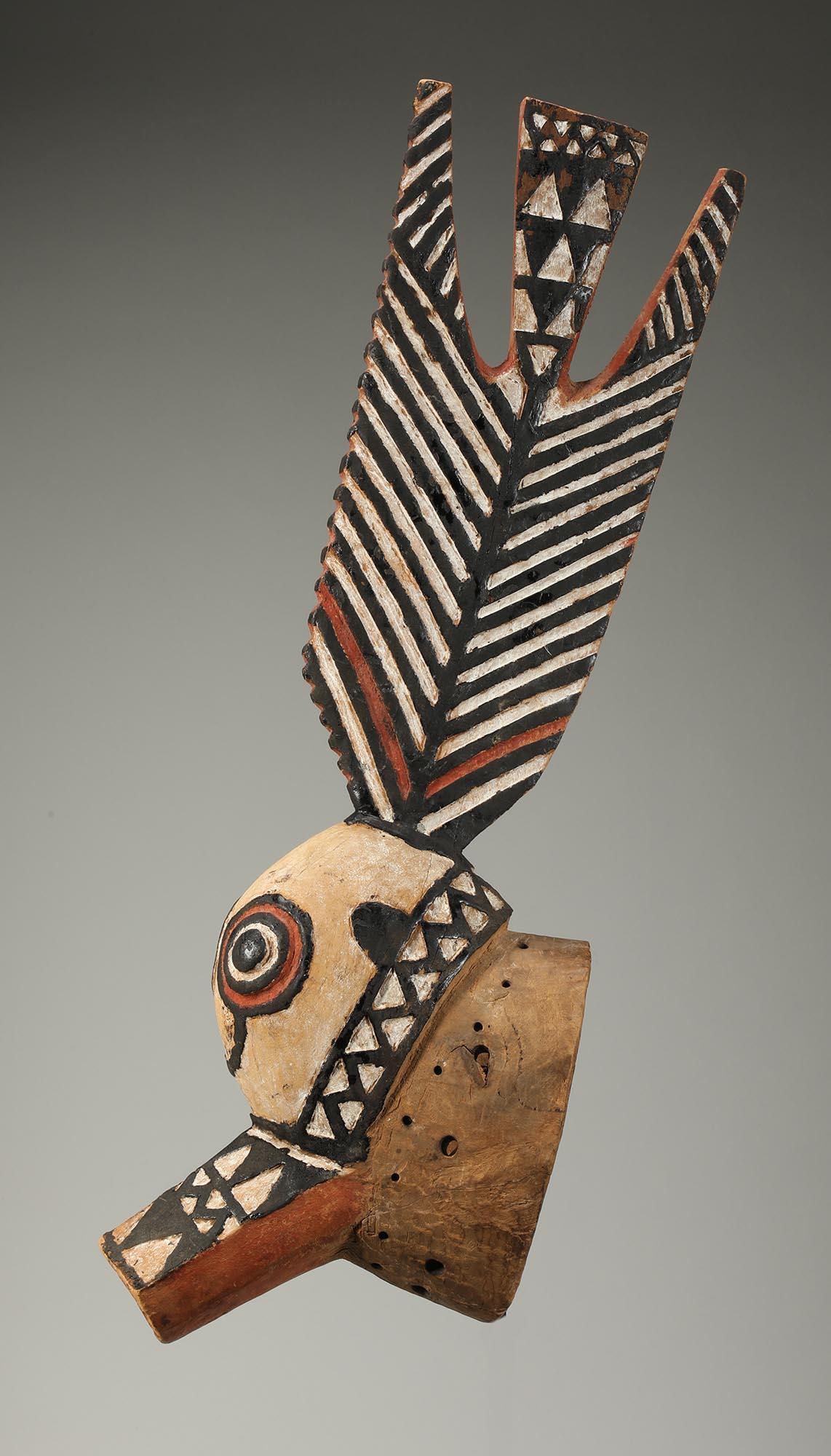 An important Bobo zoomorphic mask with fish and bird elements, added color for a dramatic impact. Includes a custom metal mount to hang on the wall.
Ex- Henri Kamer, NY, published as Bwa in Haute-Volta, 1973, # 13. original raffia costume now