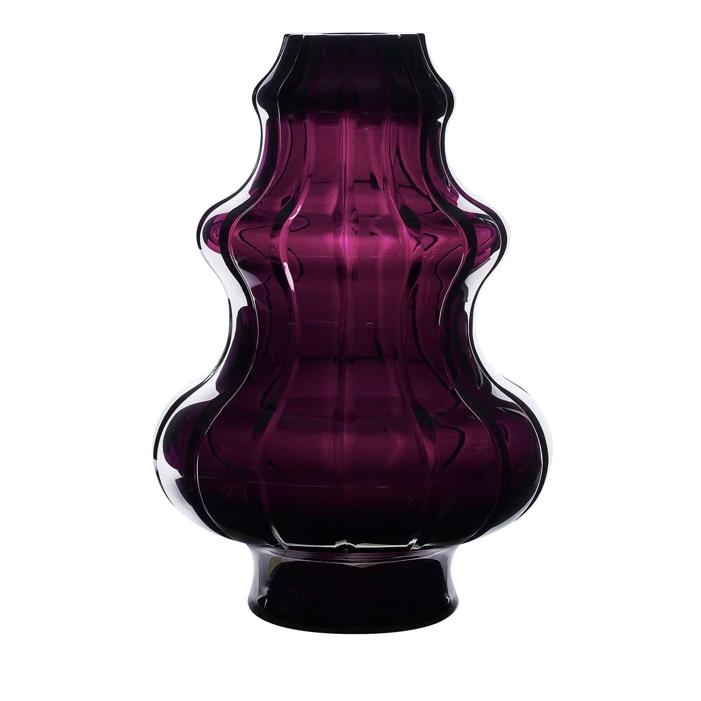 A splendid addition to a Classic living room, eclectic entryway, or modern study, this stunning vase was crafted of crystal in a sublime amethyst color. The deep burgundy hue is enclosed in a layer of transparent crystal with vertical creases that