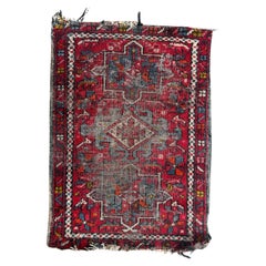 Antique distressed small Heriz rug 