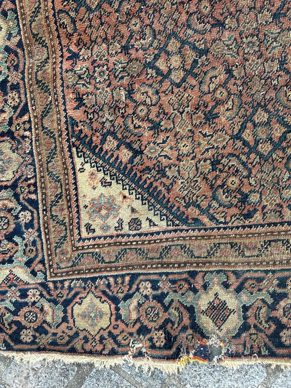 Asian Bobyrug’s distressed antique Farahan rug For Sale