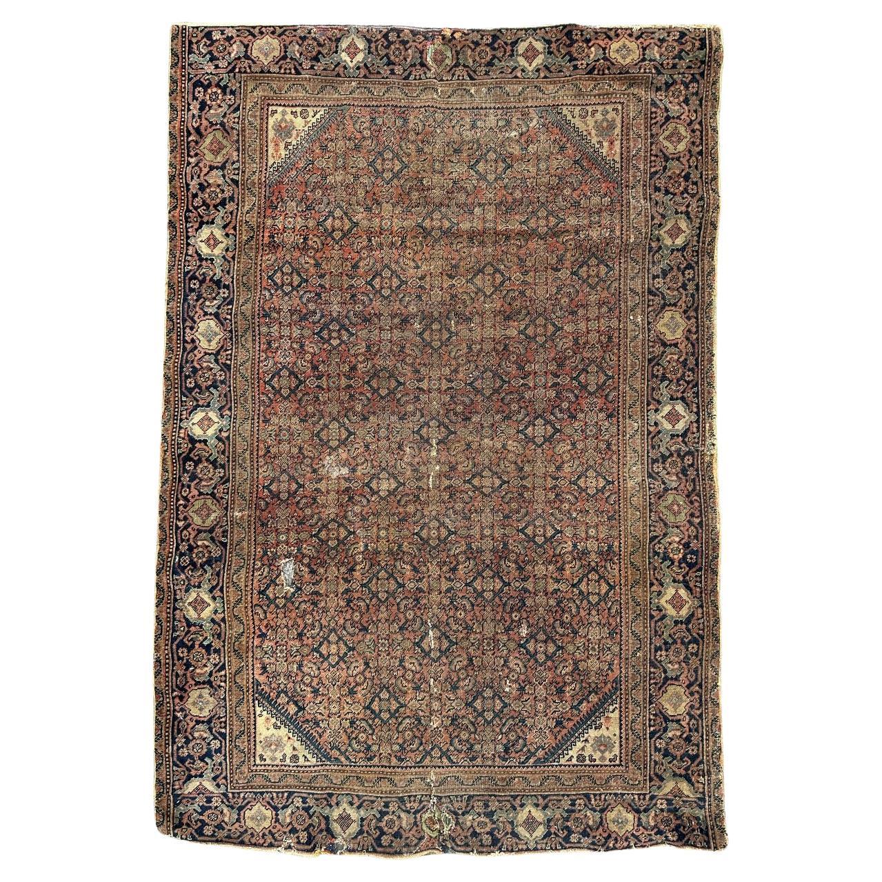 Bobyrug’s distressed antique Farahan rug For Sale