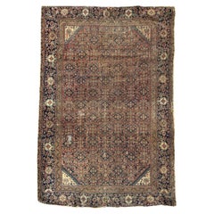Bobyrug’s distressed antique Farahan rug