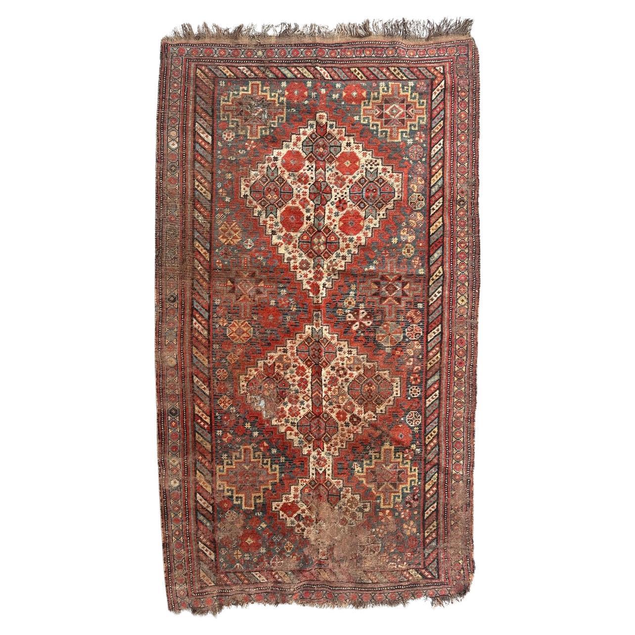 Bobyrug’s distressed antique Shiraz rug For Sale
