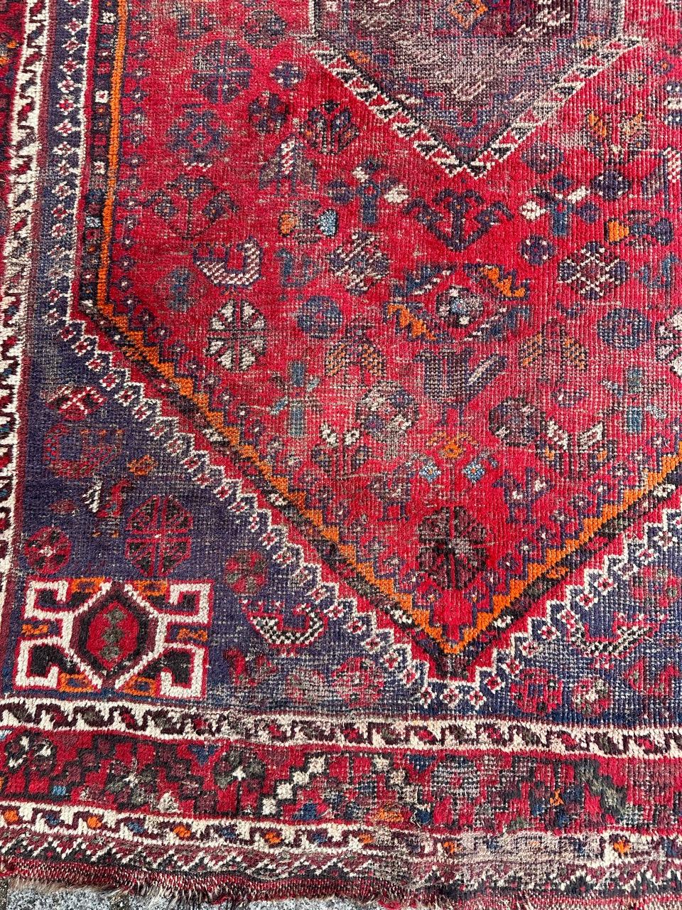 Rustic Bobyrug’s distressed mid century tribal Shiraz rug  For Sale