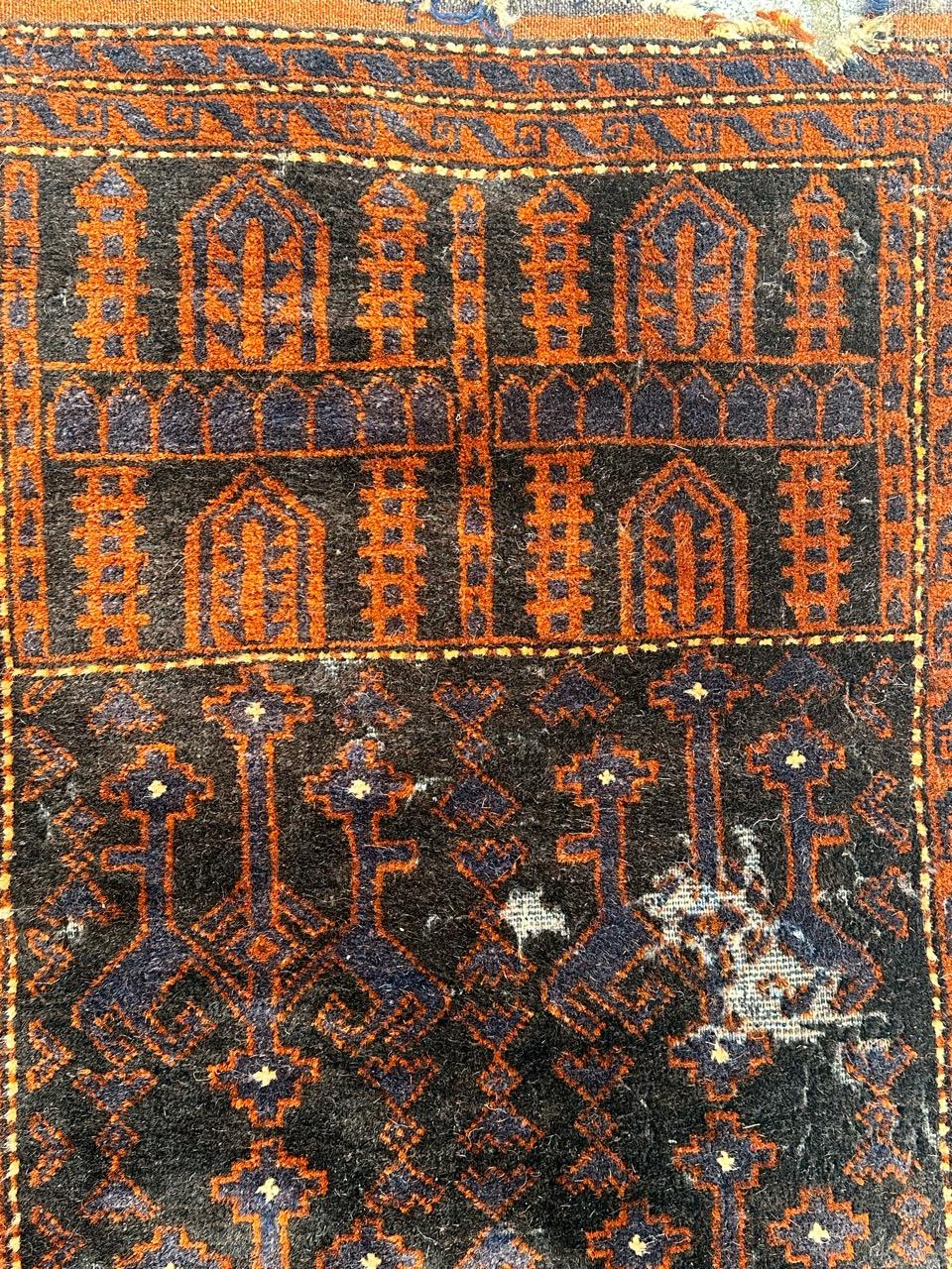 distressed vintage tribal Baluch rug  For Sale 4