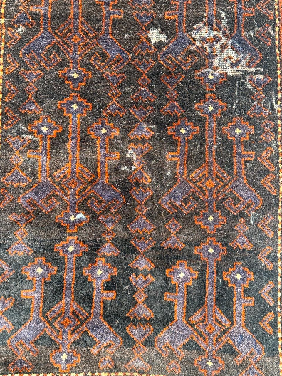 Hand-Knotted distressed vintage tribal Baluch rug  For Sale