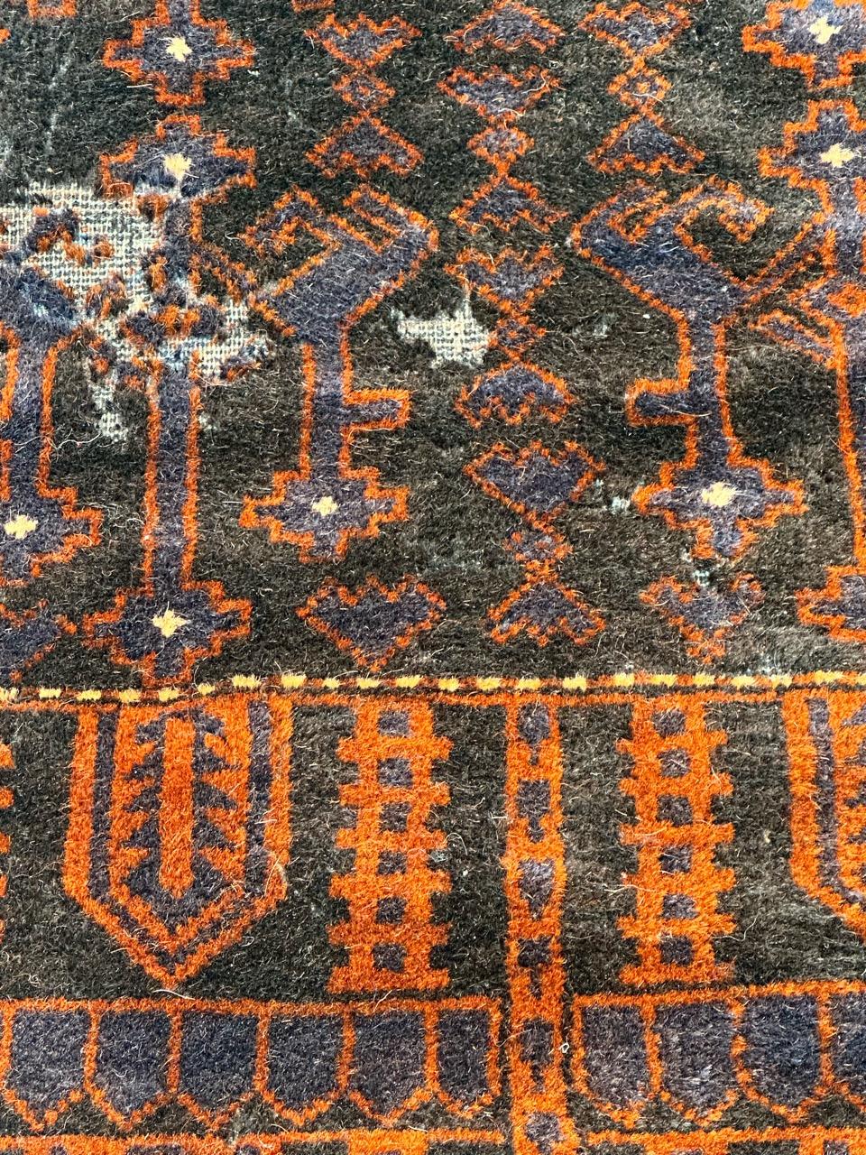 20th Century Bobyrug’s distressed vintage tribal Baluch rug  For Sale