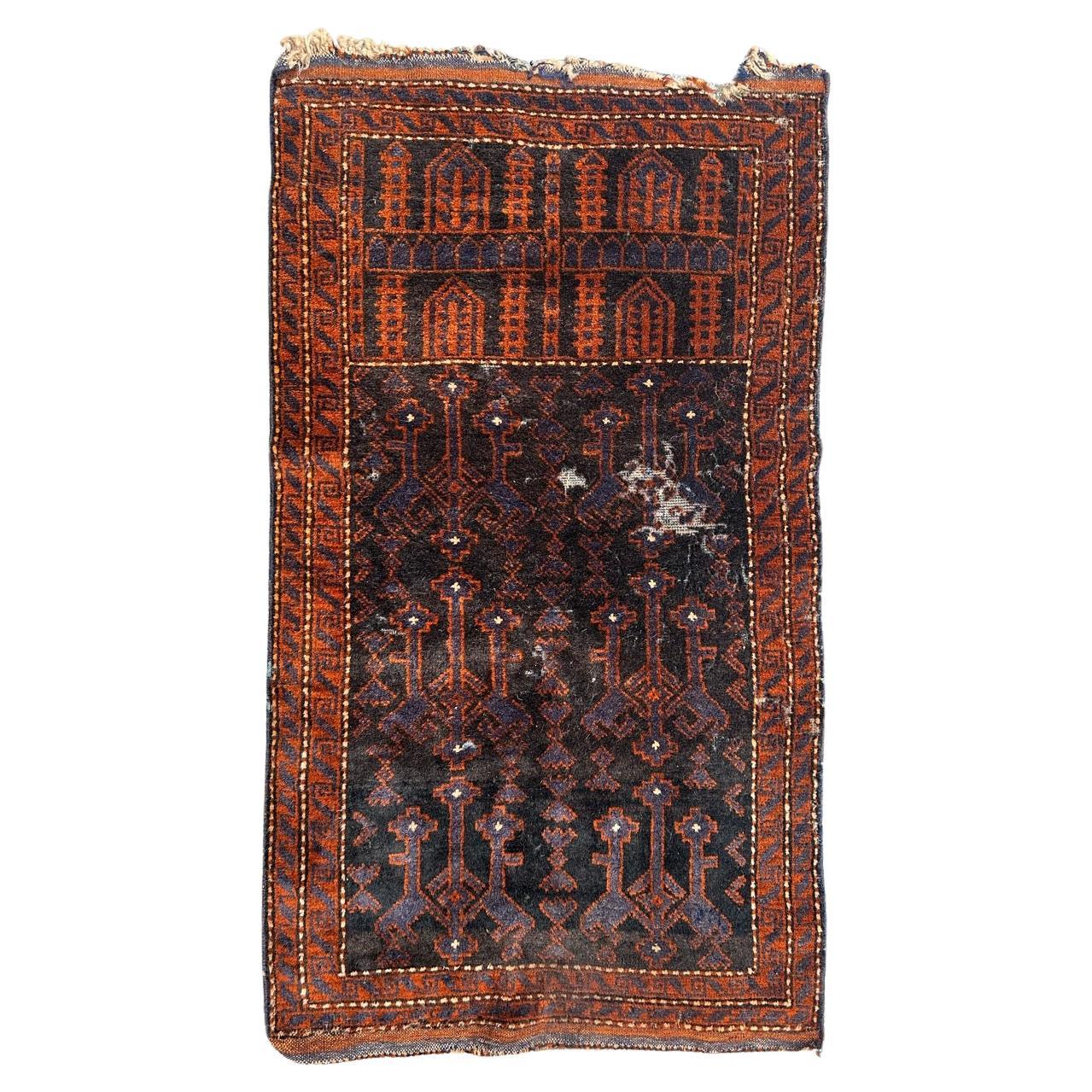 distressed vintage tribal Baluch rug  For Sale