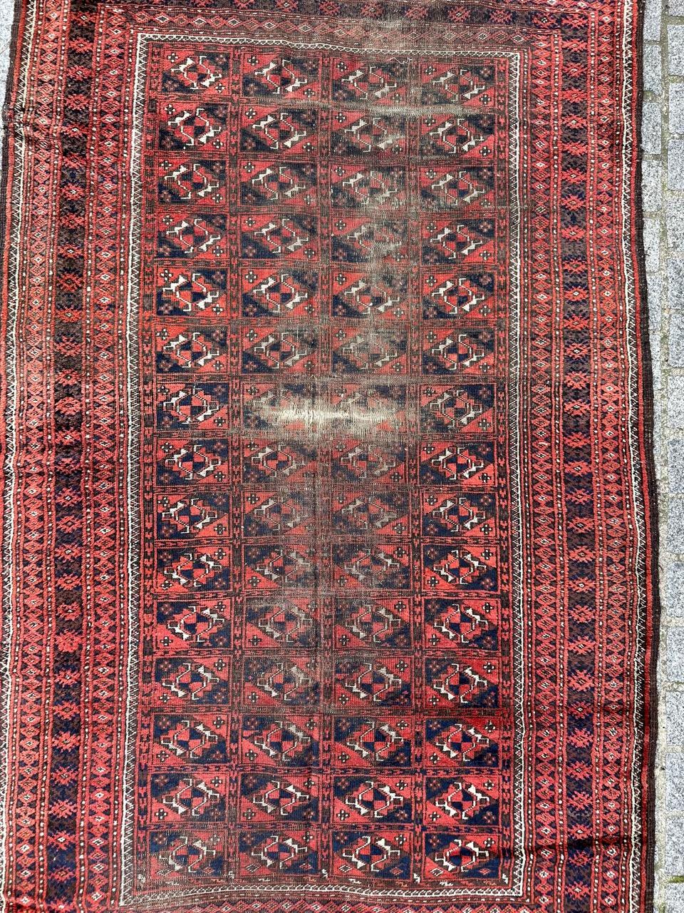 Beautiful late 19th century tribal Turkmen Baluch rug with nice tribal and geometrical design and beautiful natural colours with red, blue, brown and white, entirely and finely hand knotted with wool on wool foundation.
Important wears and a