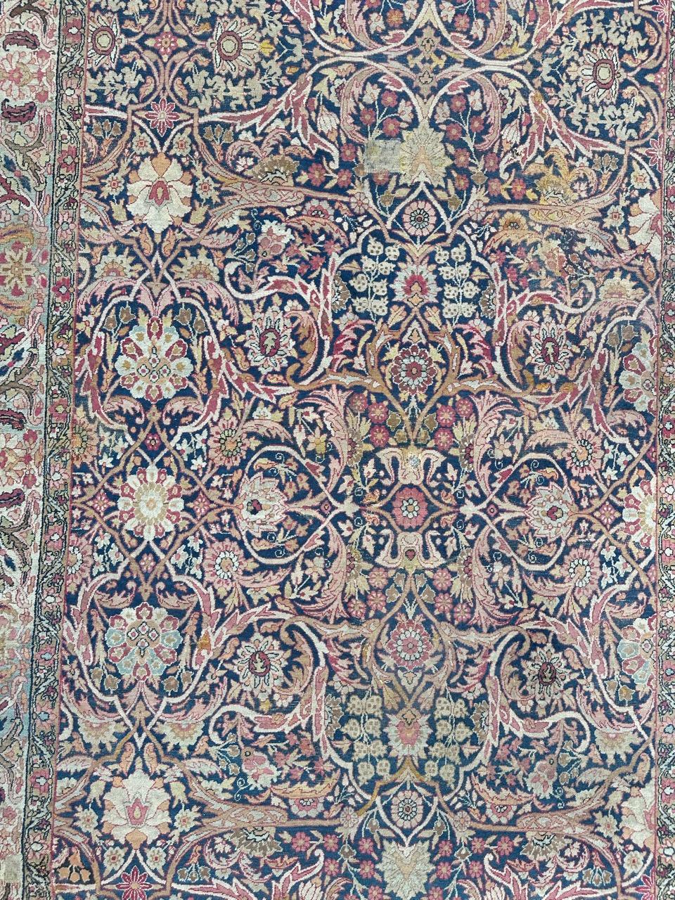 Very beautiful late 19th century large Kirman Lavar rug with beautiful decorative and all over design and nice natural colours with navy blue field, red, pink, yellow, brown and green, entirely and finely hand knotted with wool on cotton