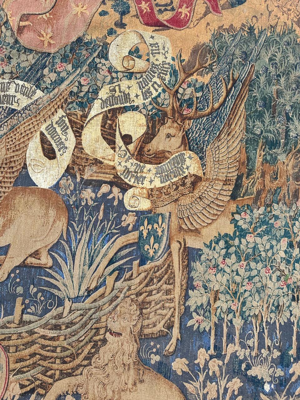 Immerse yourself in the allure of this mid-20th-century French tapestry, showcasing a design inspired by a 15th-century woven masterpiece titled 