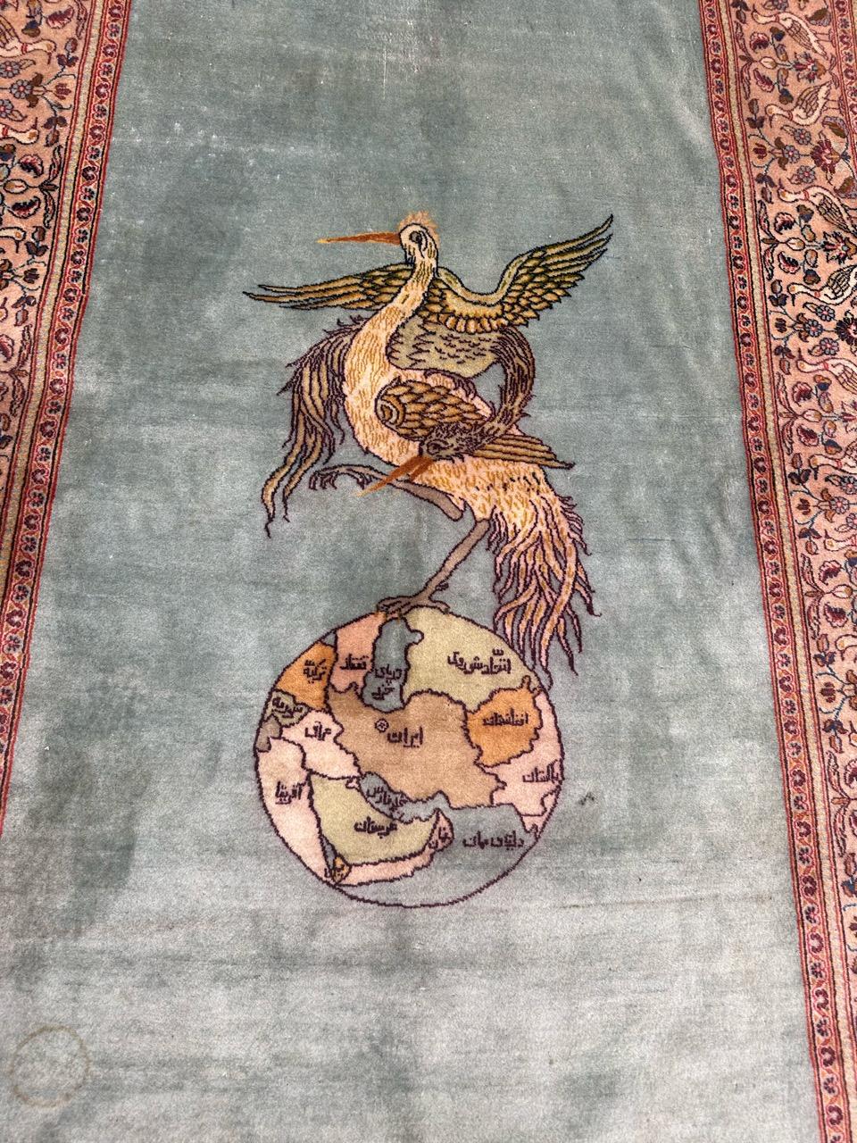 Wonderful vintage kashan rug with the signature of the renowned « Mohammad Dabir Ol Sanayee » with a design showing the earth held in one leg of an eagle which carries another eagle on it. Probably it would means a situation of the world for the