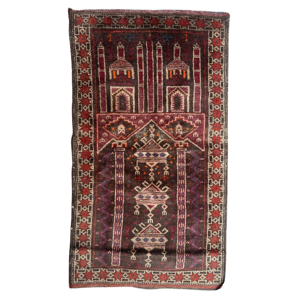 Bobyrug's nice mid century tribal Baluch rug  en vente