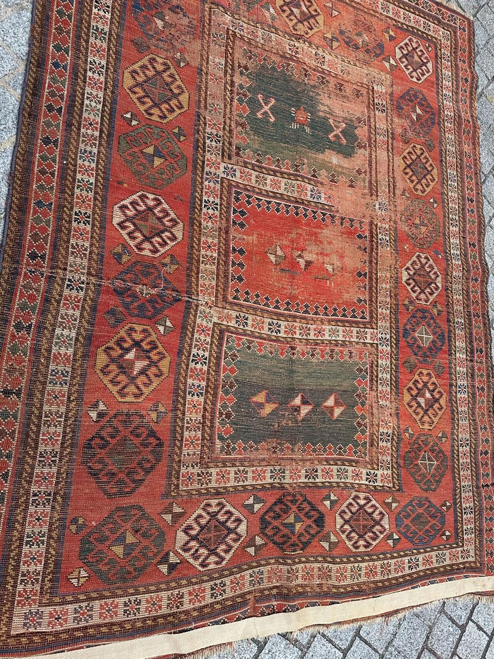 Beautiful late 19th century Caucasian rug with beautiful geometrical design and nice natural colours, in a distressed condition, with important wears and some damages, entirely hand knotted with wool on wool foundation.