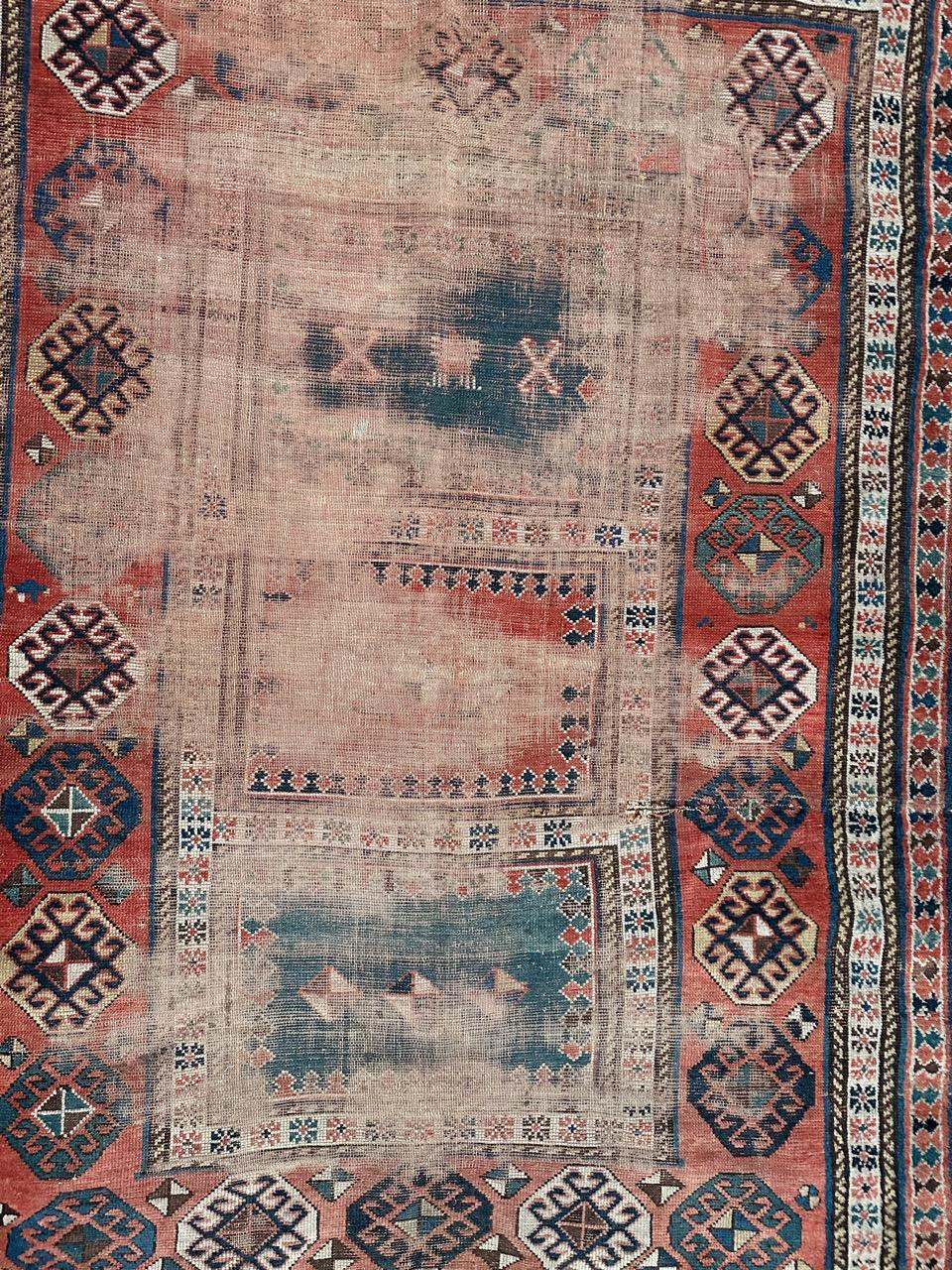 Kazakhstani Bobyrug’s pretty antique distressed Kazak rug For Sale