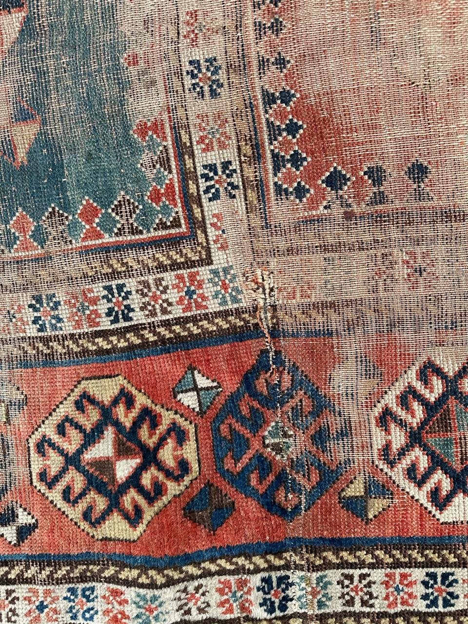Wool Bobyrug’s pretty antique distressed Kazak rug For Sale