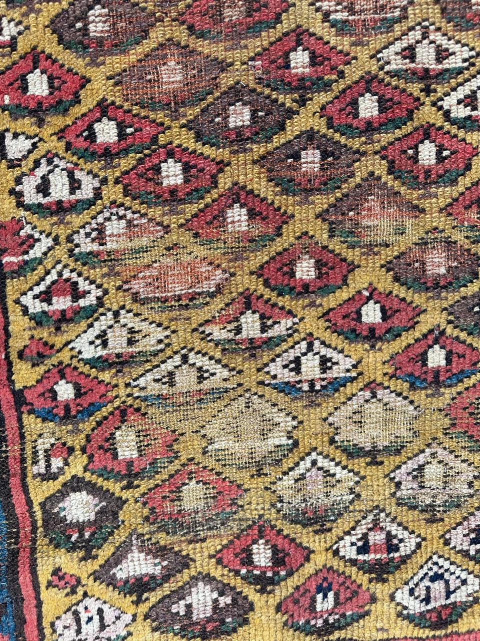 Wool Bobyrug’s pretty antique distressed Kurdish rug  For Sale