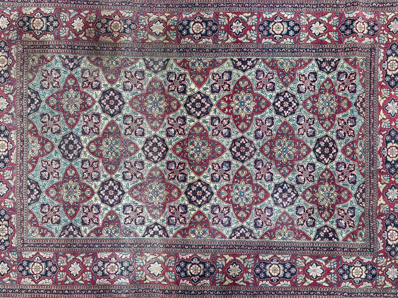 Exquisite antique Tehran rug, meticulously handwoven in fine wool on a cotton foundation, dating back to the late 19th century. This masterpiece features beautifully stylized floral designs in a stunning array of natural colors.

Set against a light