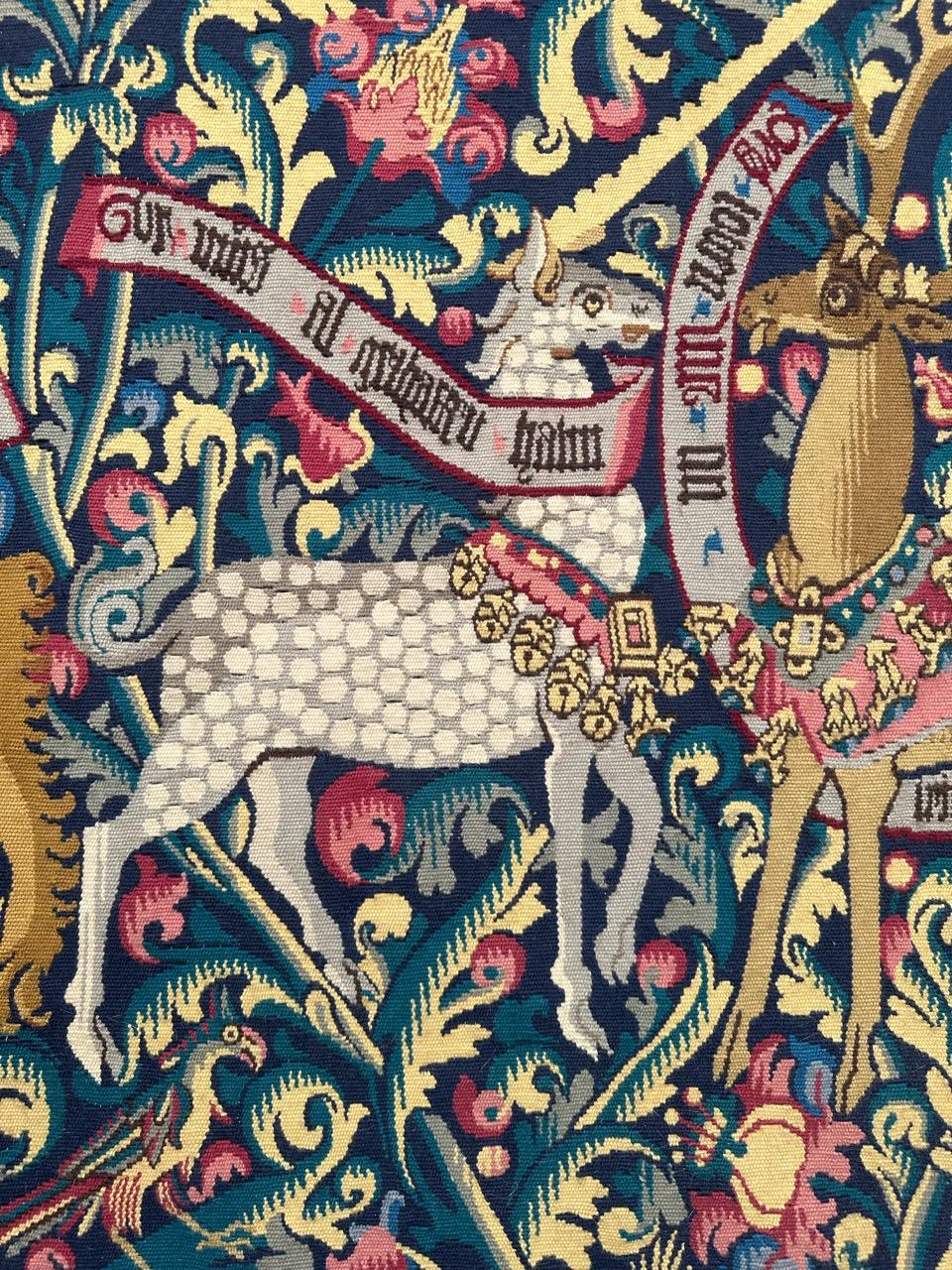 Exquisite French tapestry from the mid-20th century, handwoven in the renowned Aubusson workshops. This masterpiece replicates a 15th-century museum tapestry, featuring heraldic motifs of a lion, unicorn, and stag. Woven with precision in wool and
