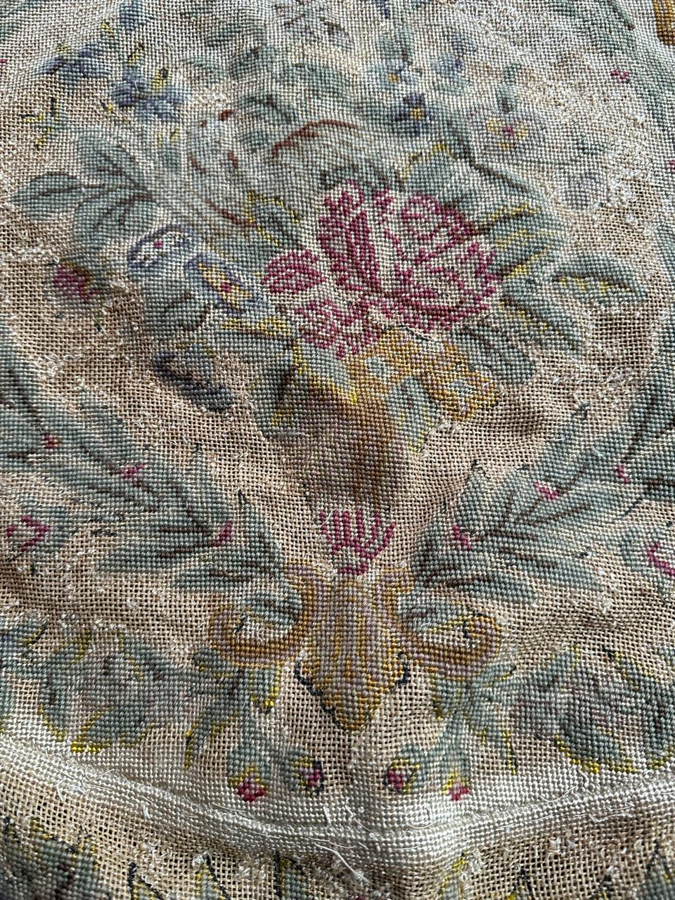 Exquisite late 19th-century French needlepoint tapestry originally from a chair cover but can be also use for cushions, or frames. Adorned with a captivating floral design from the Napoleon III era, this piece showcases vibrant natural colors.