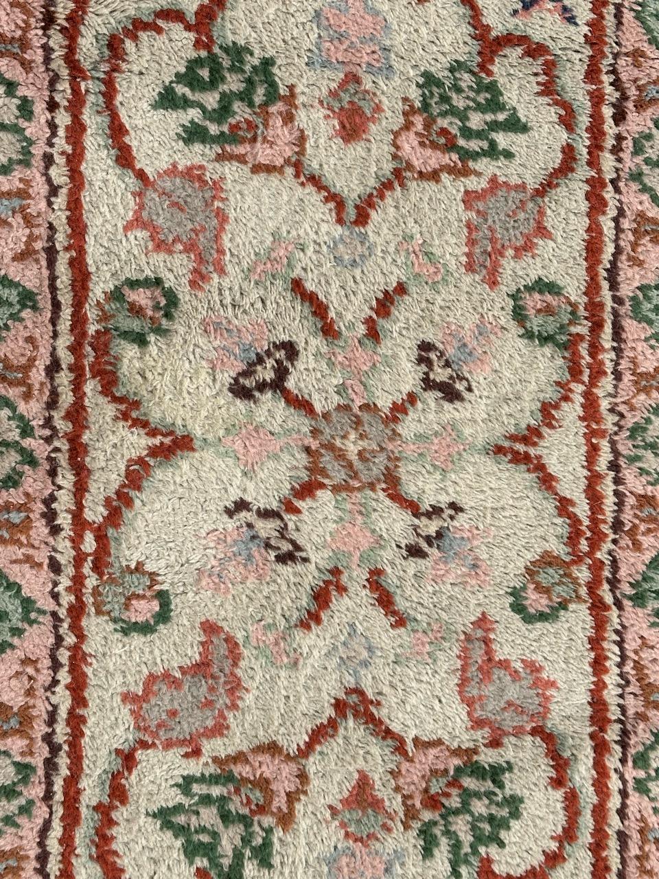 Nice early 20th century Moroccan rug with a design of the Smyrne and oushak rugs, with a white field, pink, green and orange in design, entirely hand knotted with wool on cotton foundation 

✨✨✨
