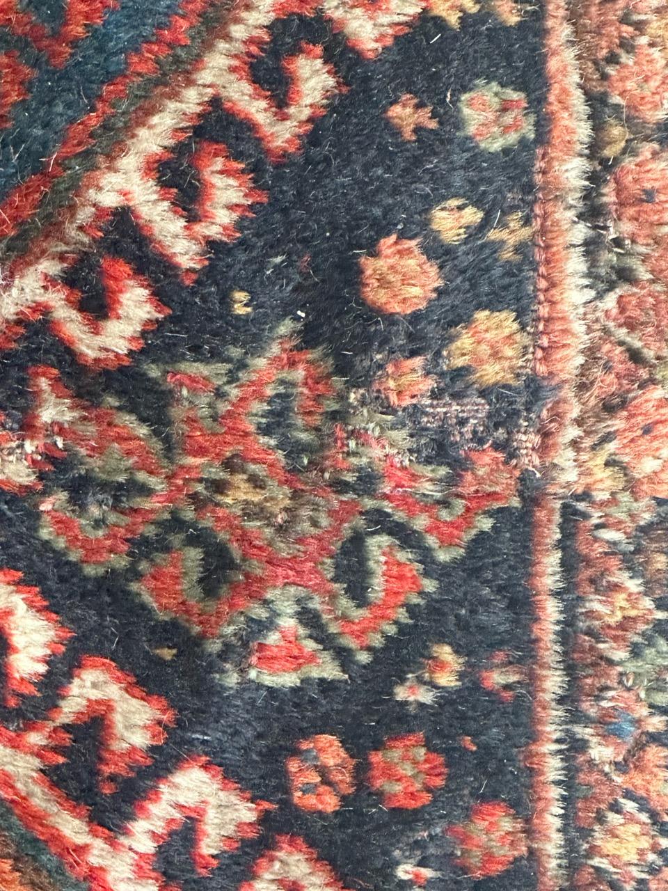 Nice antique qashqai fragment rug with beautiful geometrical and tribal design and nice natural colours with navy blue, red, orange, blue, green and white, entirely hand knotted with wool on wool foundation. This piece is an assembly of two pieces