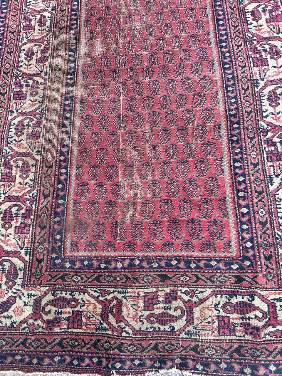 Beautiful early 20th century Turkish Sparta runner with nice design with Botteh, and nice natural colours with a pink background with sky blue, dark blue and white. Some wears due to the age and the use, and the rug has been reduced at the width.