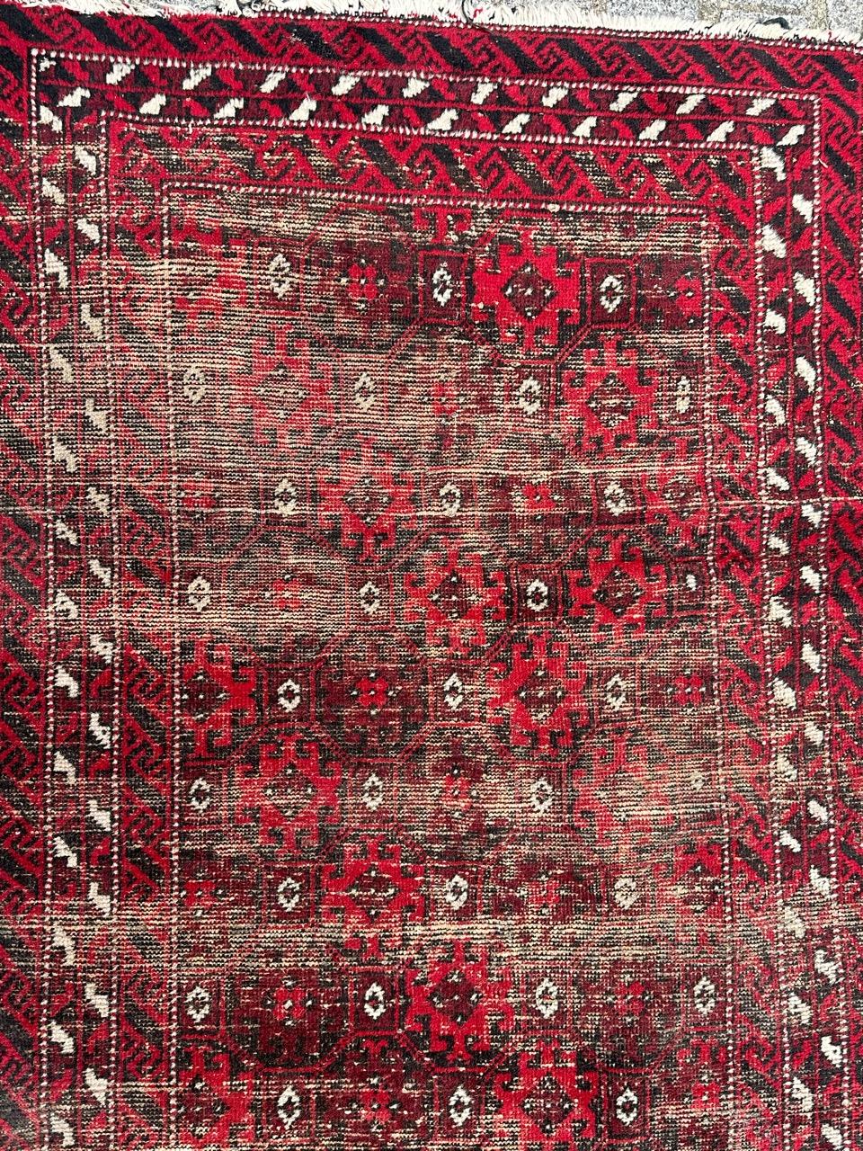 Wool Bobyrug’s pretty distressed vintage Baluch Afghan rug  For Sale