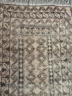 Pretty faded mid century Baluch rug