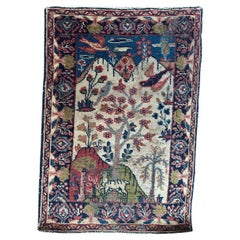 Bobyrug’s pretty little distressed antique pictorial Tabriz rug 
