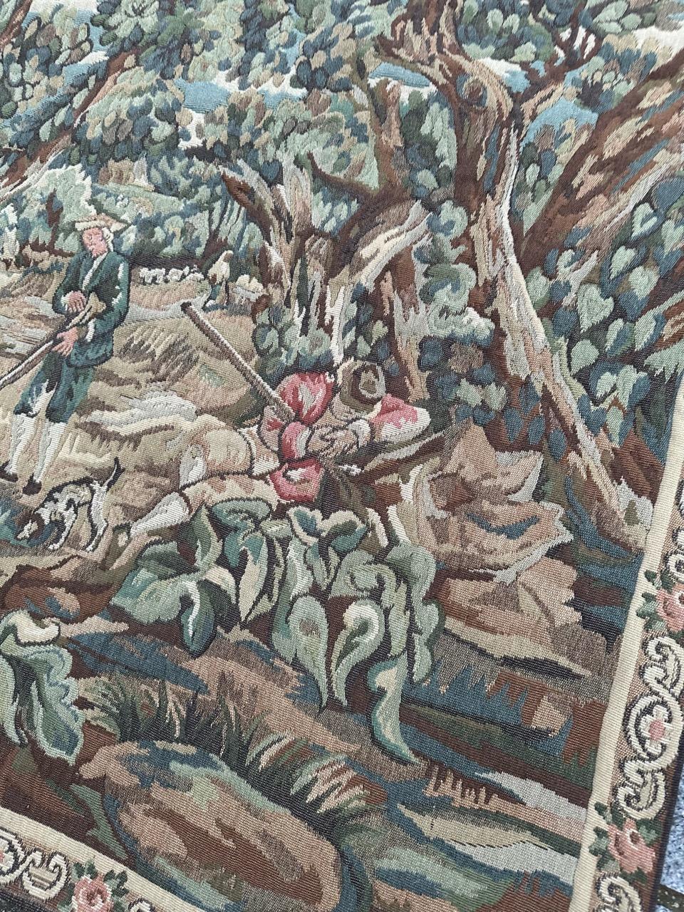 Halte des Chasseurs (hunters' stop)
Beautiful tapestry from the second half of the 20th century, crafted on Jacquard looms using wool and cotton with lovely shades of green and an exquisite design. Inspired by an 18th-century Aubusson tapestry, it
