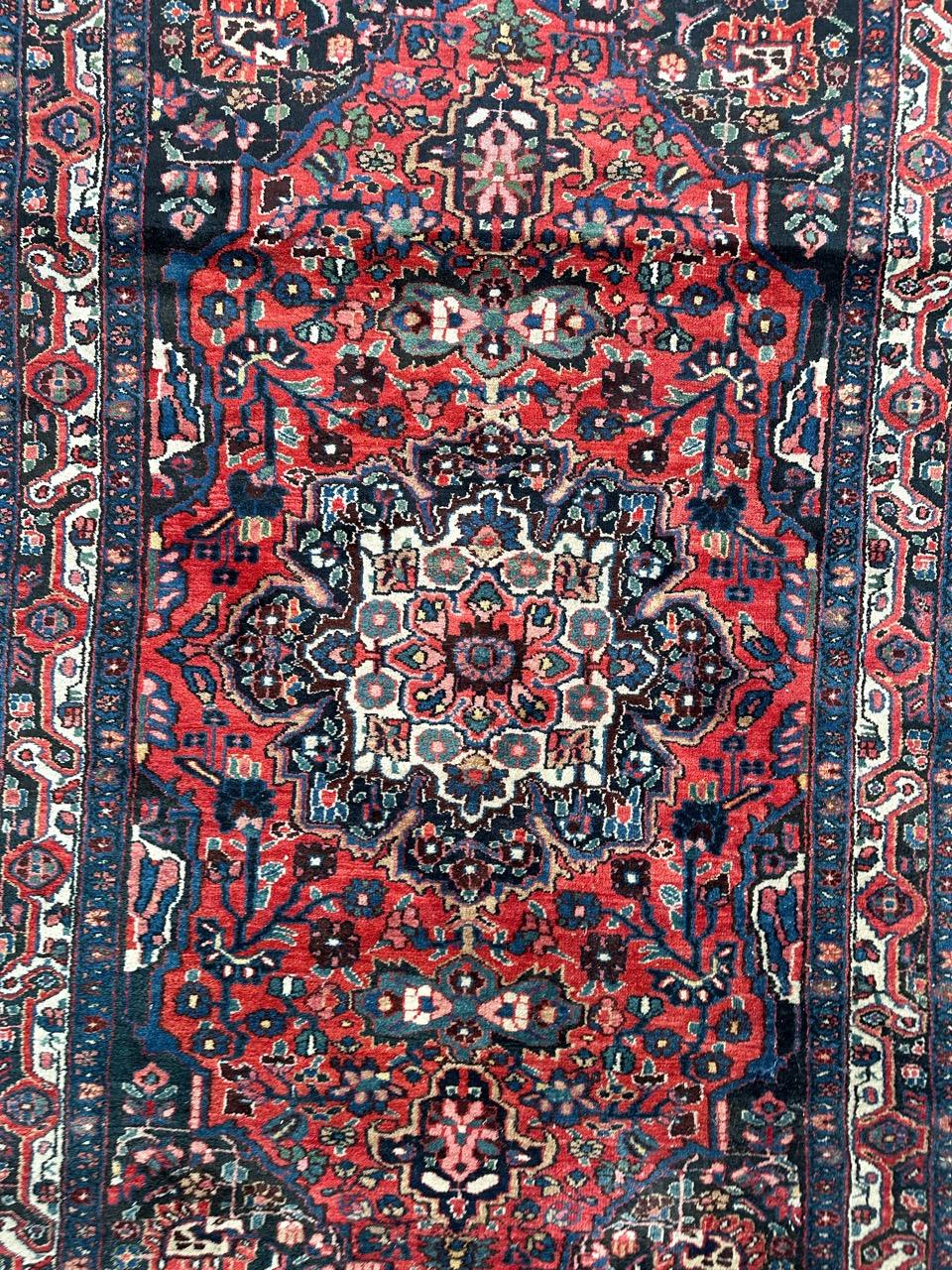 Beautiful mid 20th century Kurdish rug with a nice floral design with a central medallion and beautiful colours with a red field and blue, green and pink in design, entirely hand knotted with wool on cotton foundation.

✨✨✨
