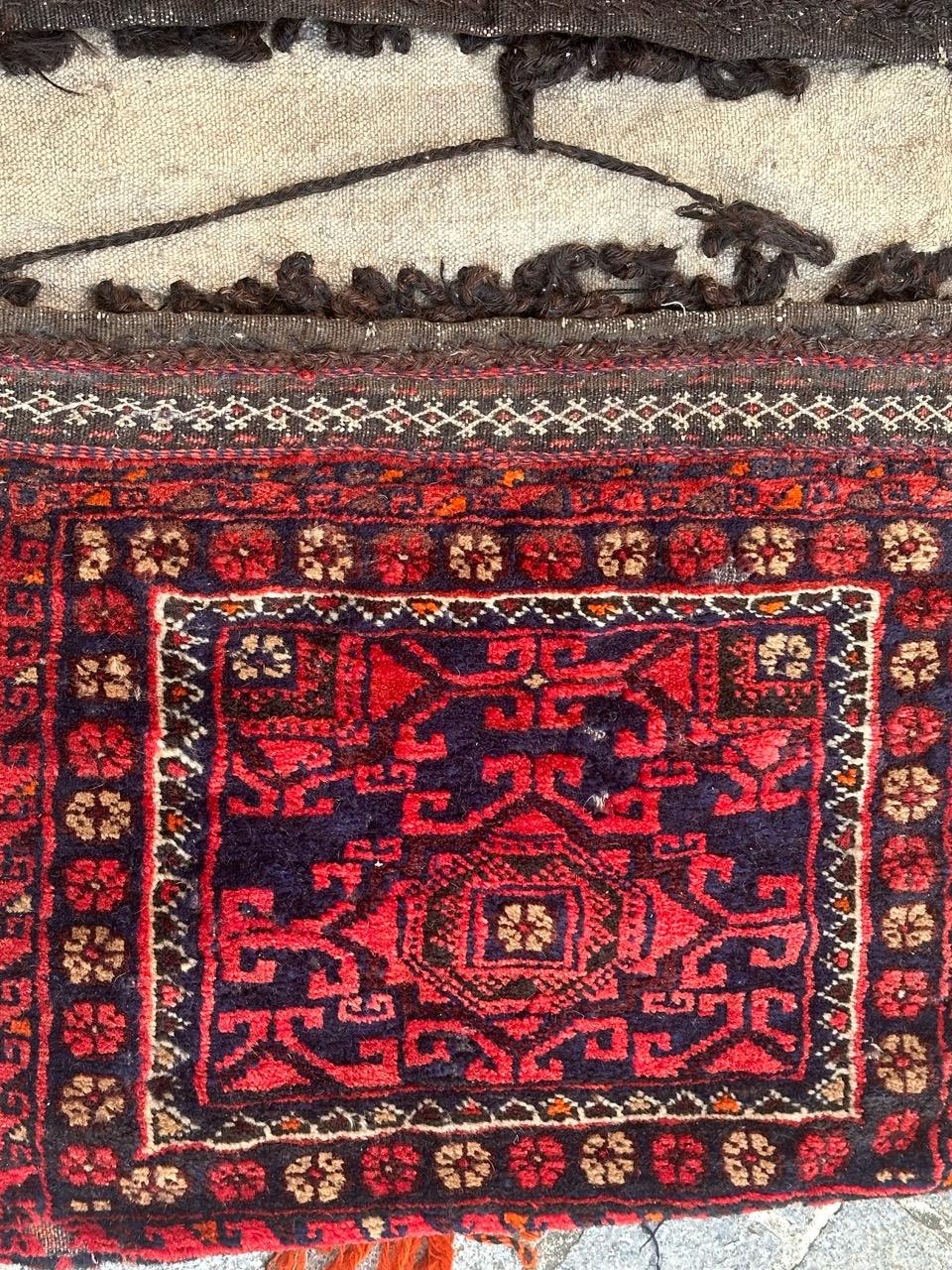 Very beautiful mid century chuval or bag faces rug with beautiful geometrical and tribal design and nice natural colours, with a composition of two bag faces, with a woven Kilim part between the two bag faces, folded to make a horse cover, entirely