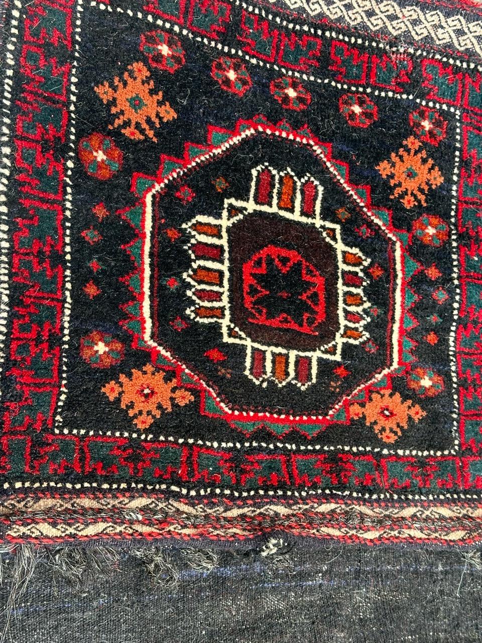 Very beautiful mid century chuval or bag faces rug with beautiful geometrical and tribal design and nice natural colours, with a composition of two bag faces, with a woven Kilim part between the two bag faces, folded to make a horse cover, entirely