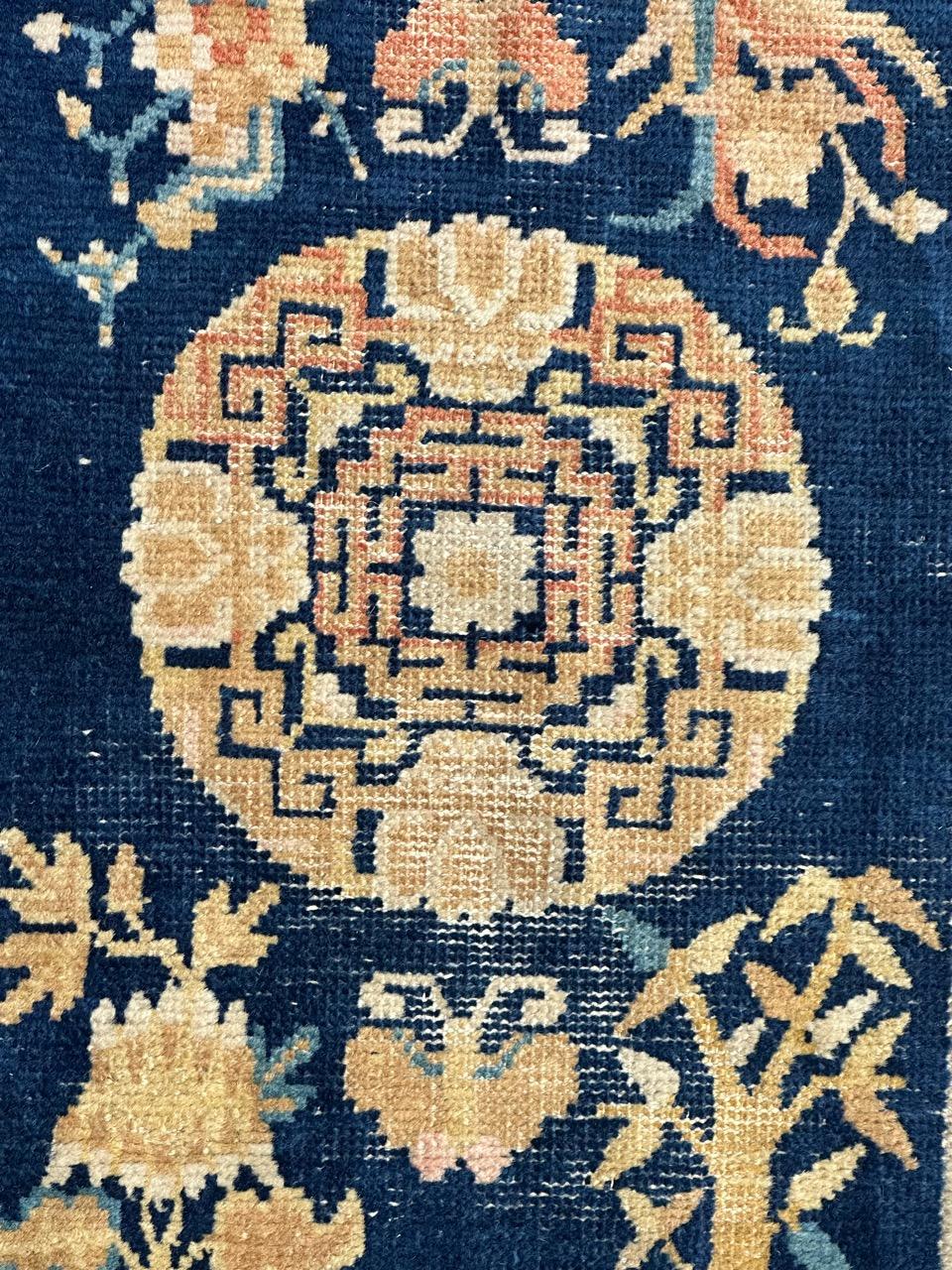 Very nice antique and rare Chinese rug from Ningxia with nice Chinese design and symbols on design, and nice natural colours with a navy blue field and yellow, gold, orange , white and sky blue on design, a beautiful border with stylized designs