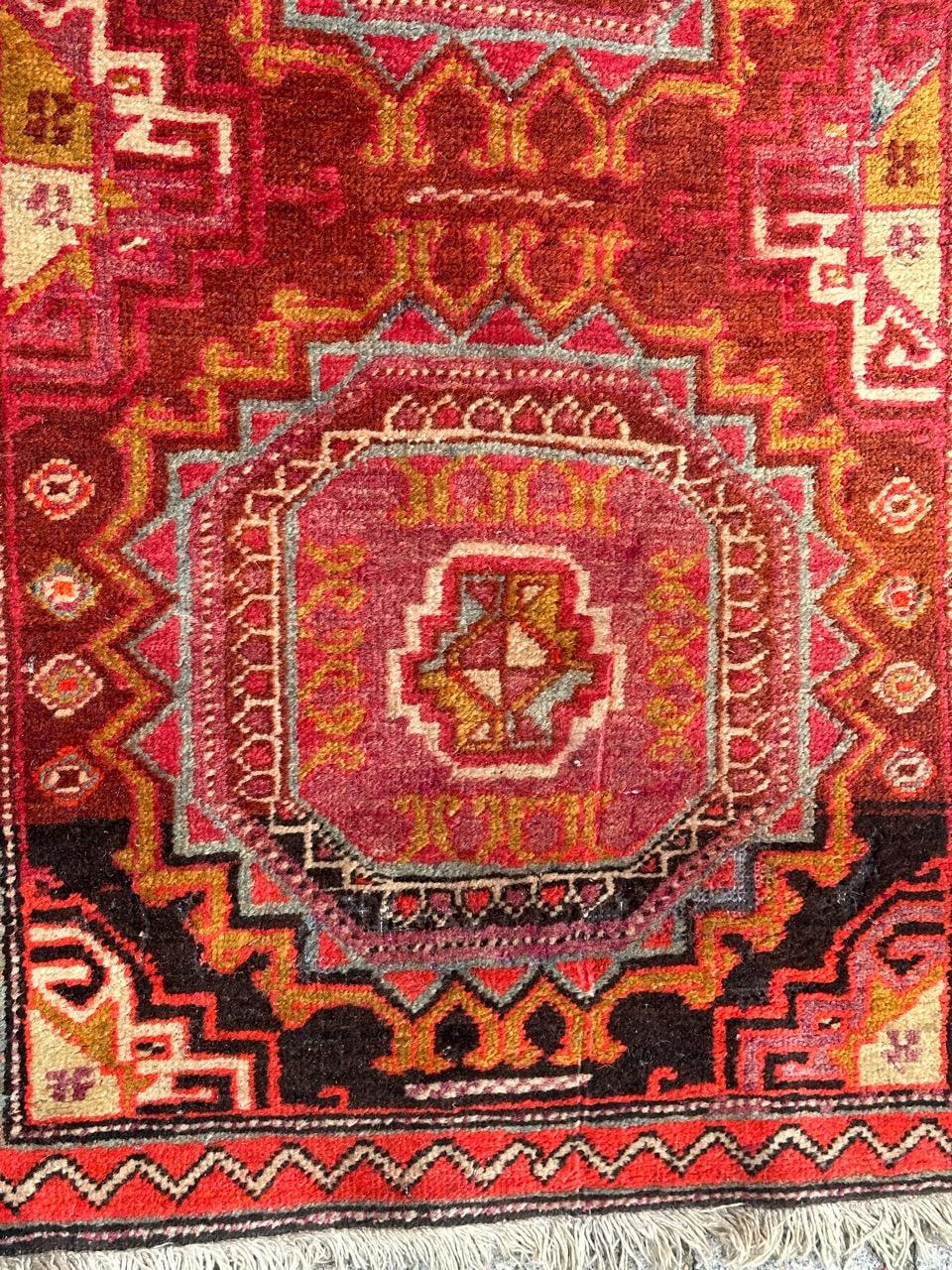 Beautiful mid century Azerbaijan rug with nice geometrical and tribal design in style of the Turkmen rugs, and nice colours with a dark brown, and purple field, purple, sky blue, green, red and white, entirely hand knotted with wool on cotton