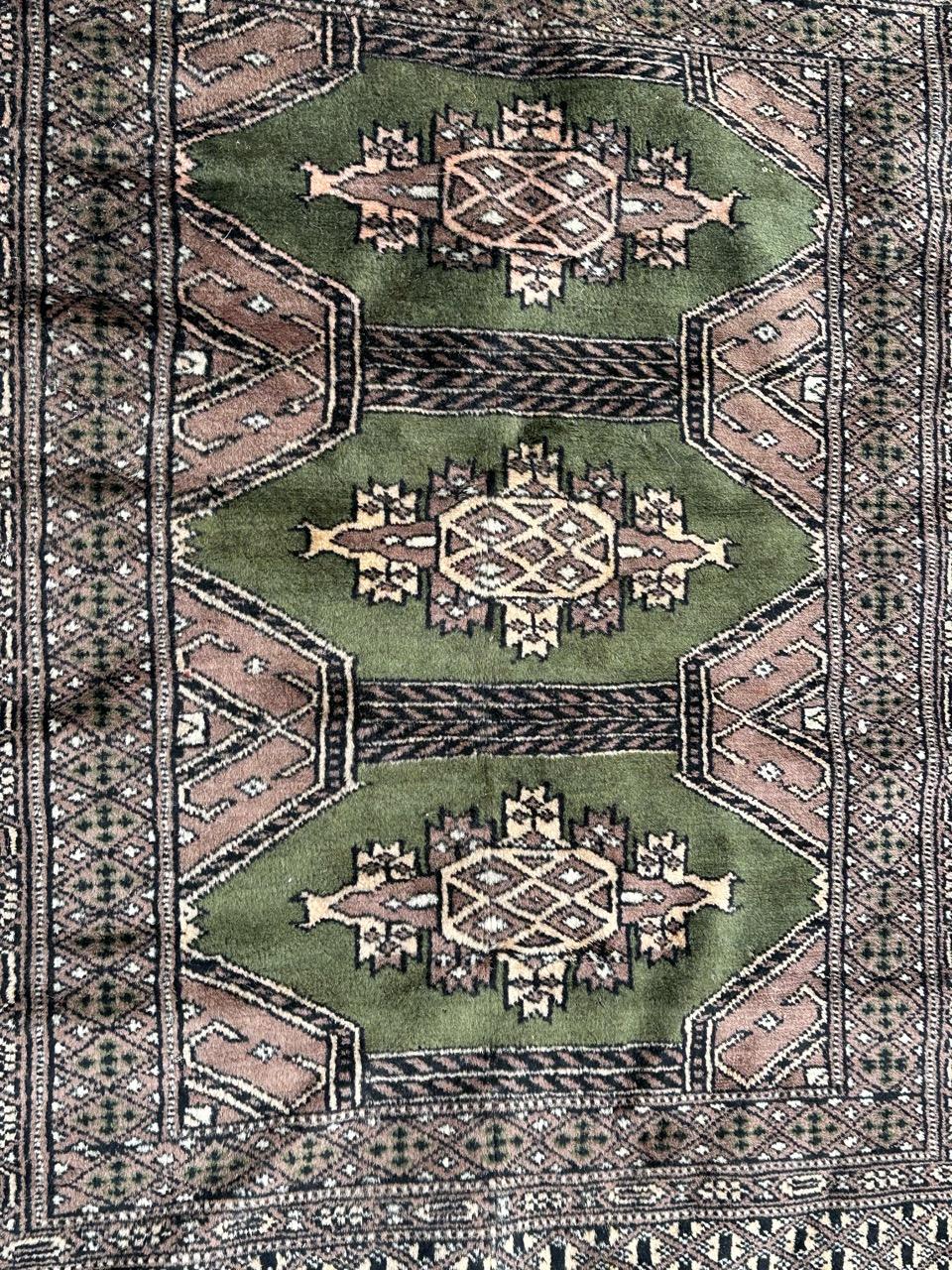 Pretty small vintage Pakistani rug with nice geometrical design in style of Turkmen rugs, and beautiful colours with green field, pink, yellow , white and black, entirely and finely hand knotted with wool on cotton foundation.

✨✨✨
