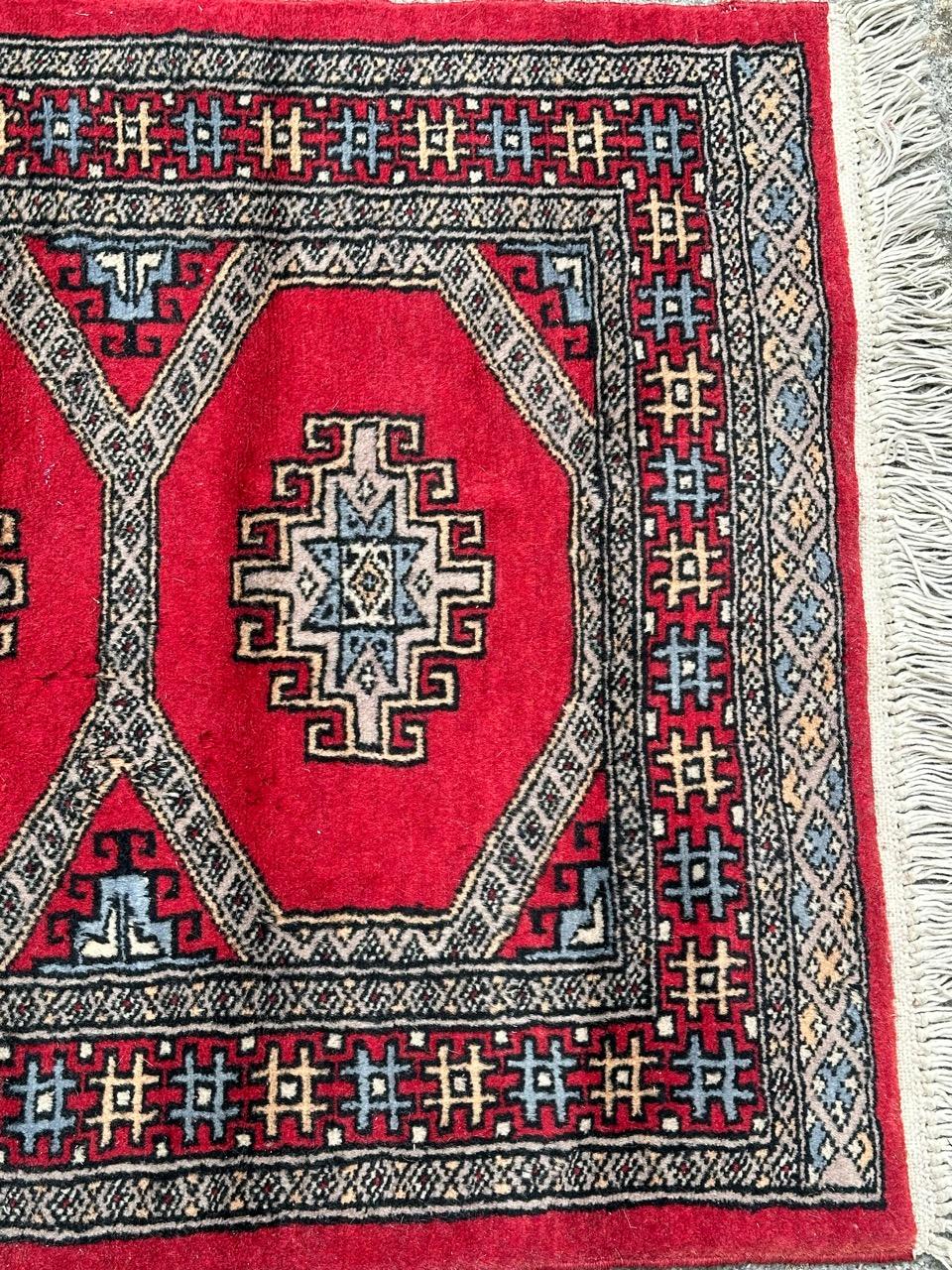 Pretty small vintage Pakistani rug with nice geometrical design in style of Turkmen rugs, and beautiful colours with red field, blue, grey, white and black, entirely and finely hand knotted with wool on cotton foundation.

✨✨✨
