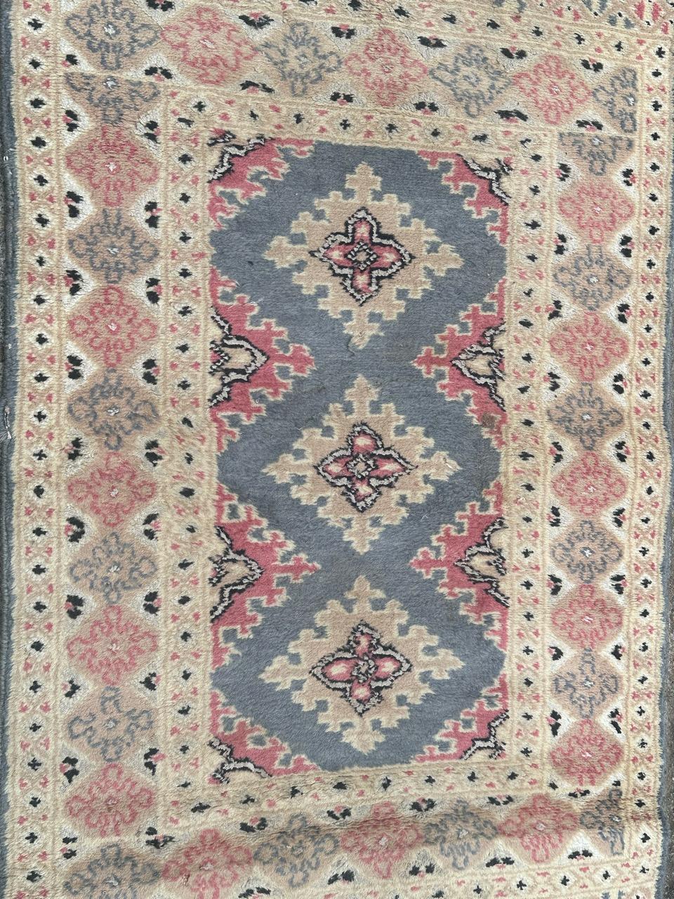 Pretty small vintage Pakistani rug with nice geometrical design in style of Turkmen rugs, and beautiful colours with pink, sky blue, beige, white and black, entirely and finely hand knotted with wool on cotton foundation.

✨✨✨
